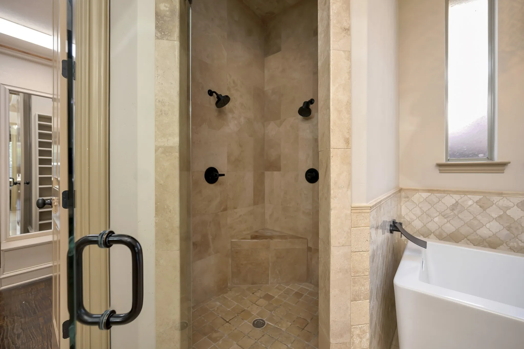 Detailed, Oversized Shower with 2 Shower Heads and Bench Seat.
