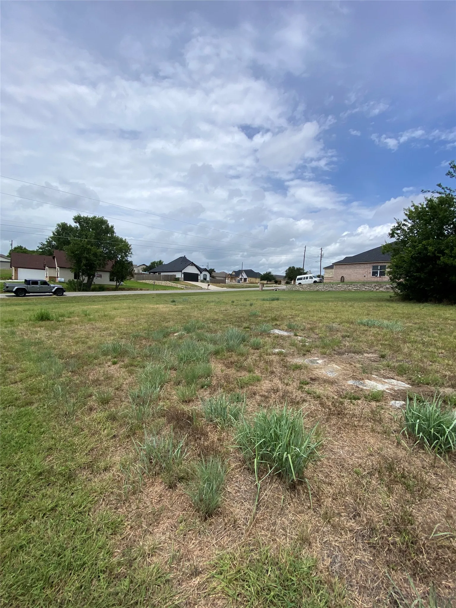 Expansive land parcel featuring existing natural ground cover