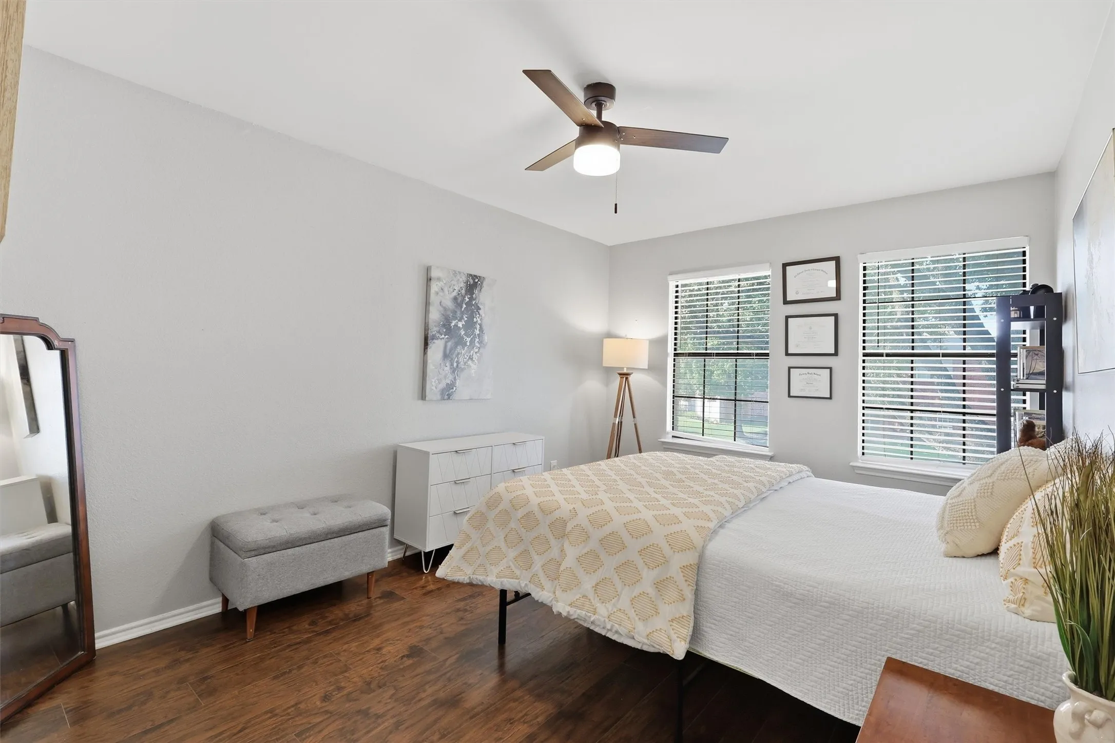 Bright room featuring wood-finish flooring and light gray walls