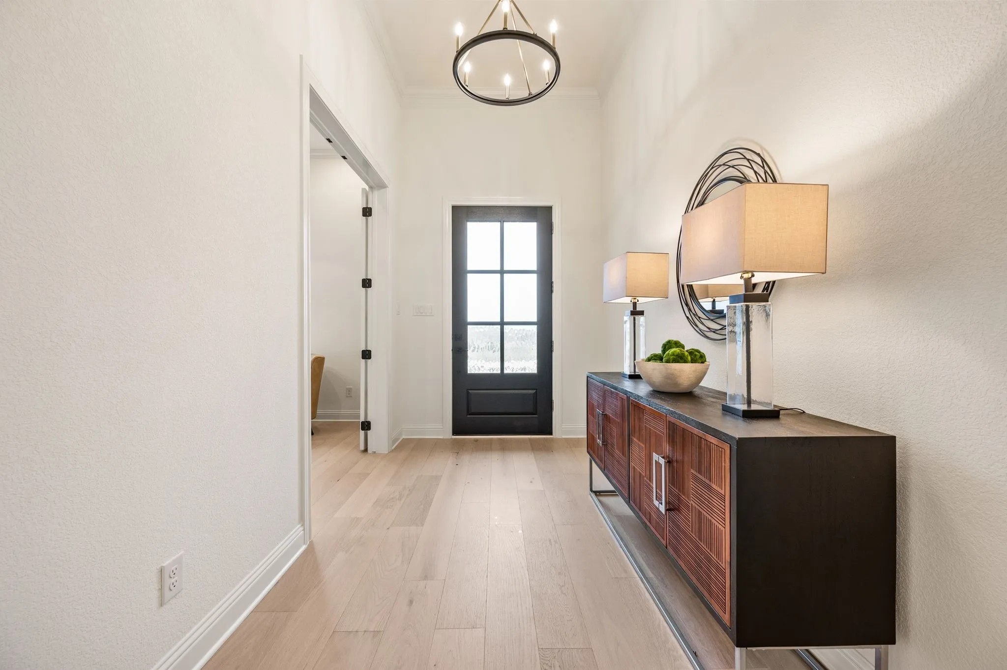 Light wood-finish flooring throughout the entryway