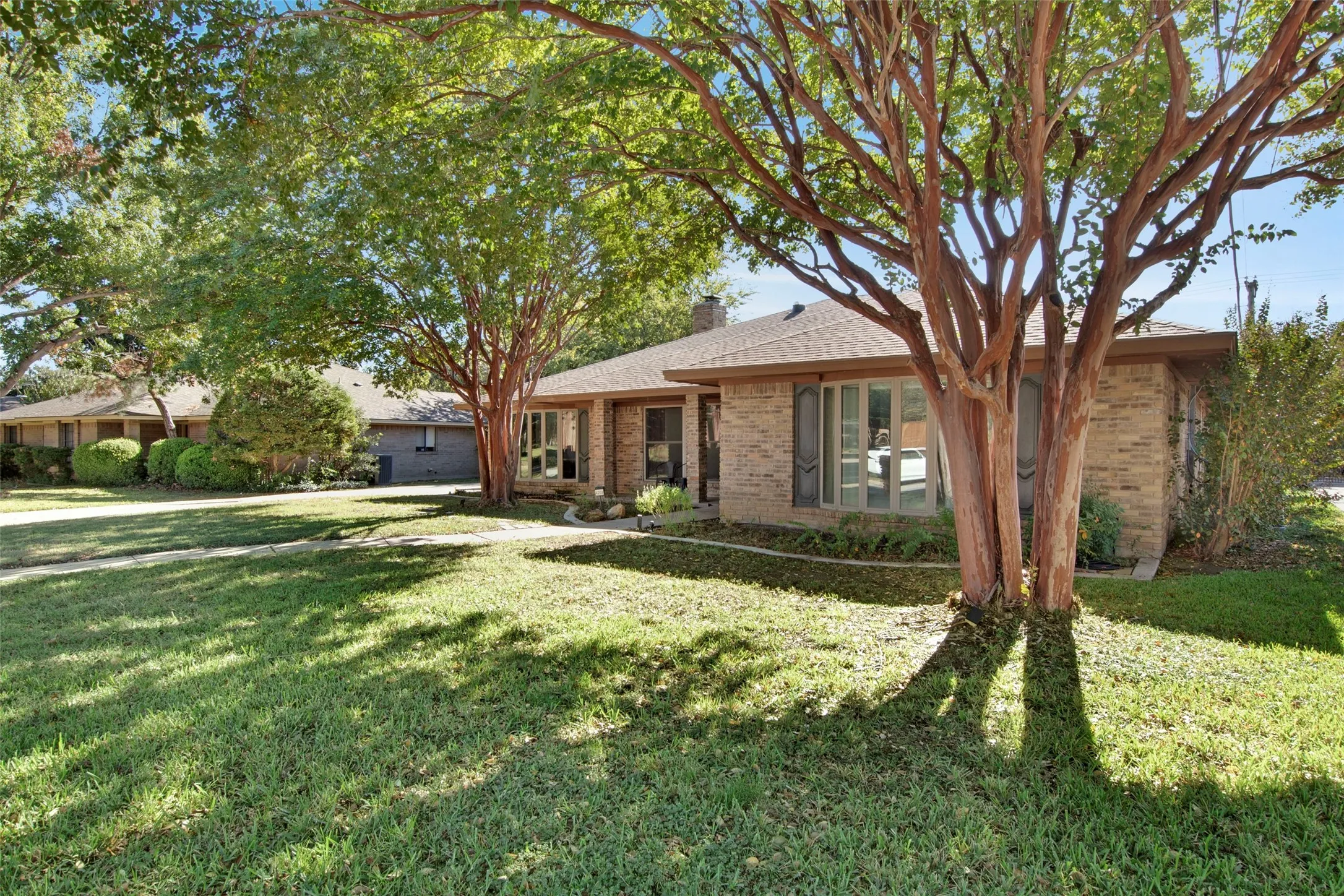 Ranch-style home with a front yard