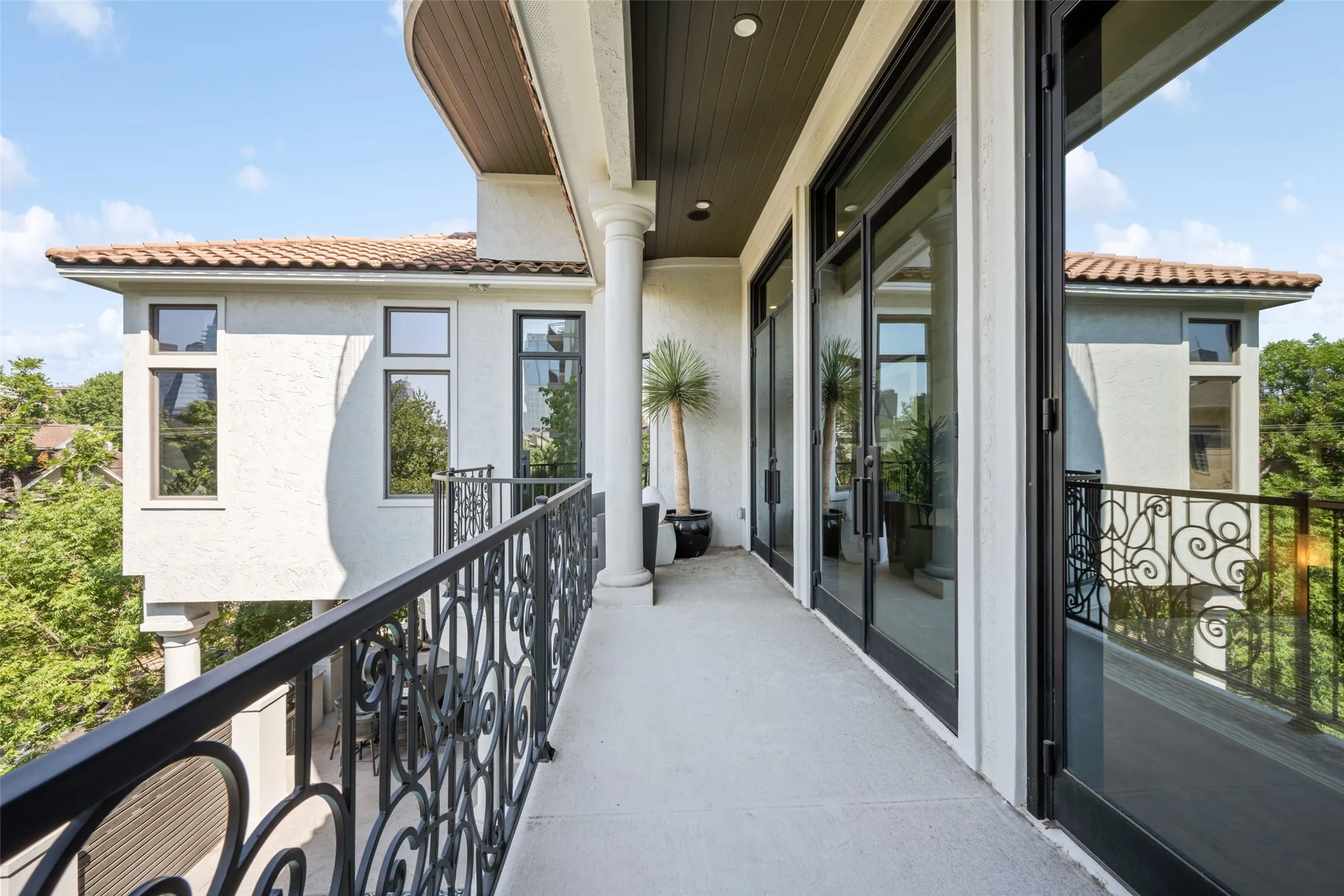 Primary Suite Balcony Doors Open to a Balcony