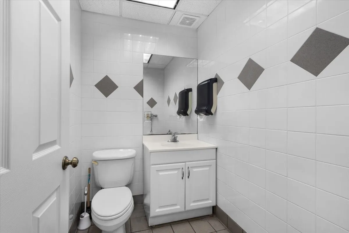 White ceramic wall tiling with accent diamonds