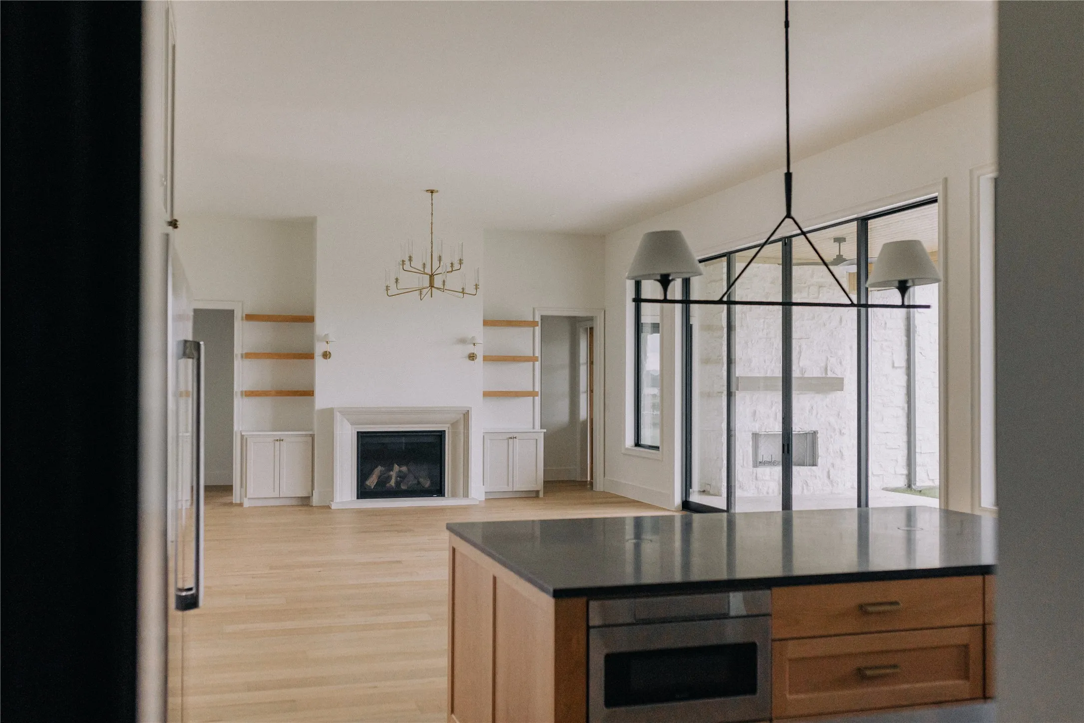 Open-concept living space featuring light wood-finish flooring throughout