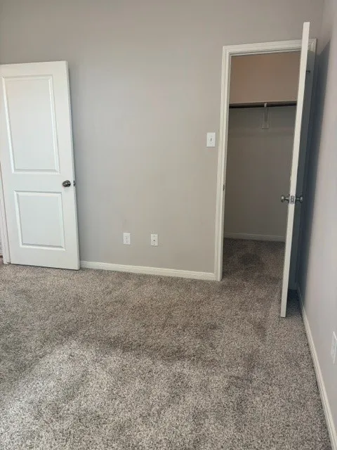 Bedroom #2 with carpet and blinds