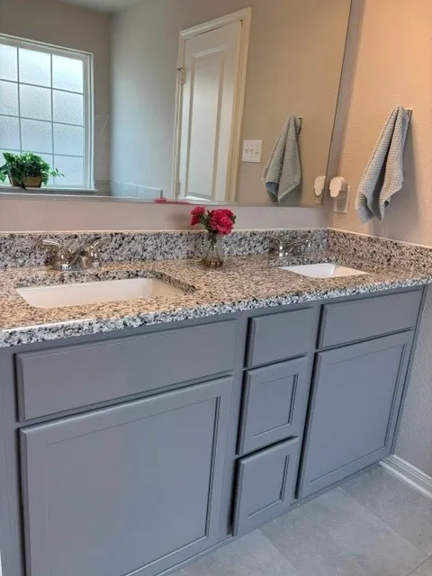 With double sinks and granite counter tops