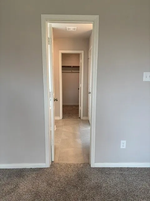 Leads into walk in closet