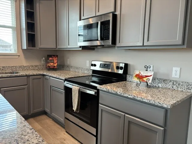Built in microwave, electric stove and 42 inch cabinets