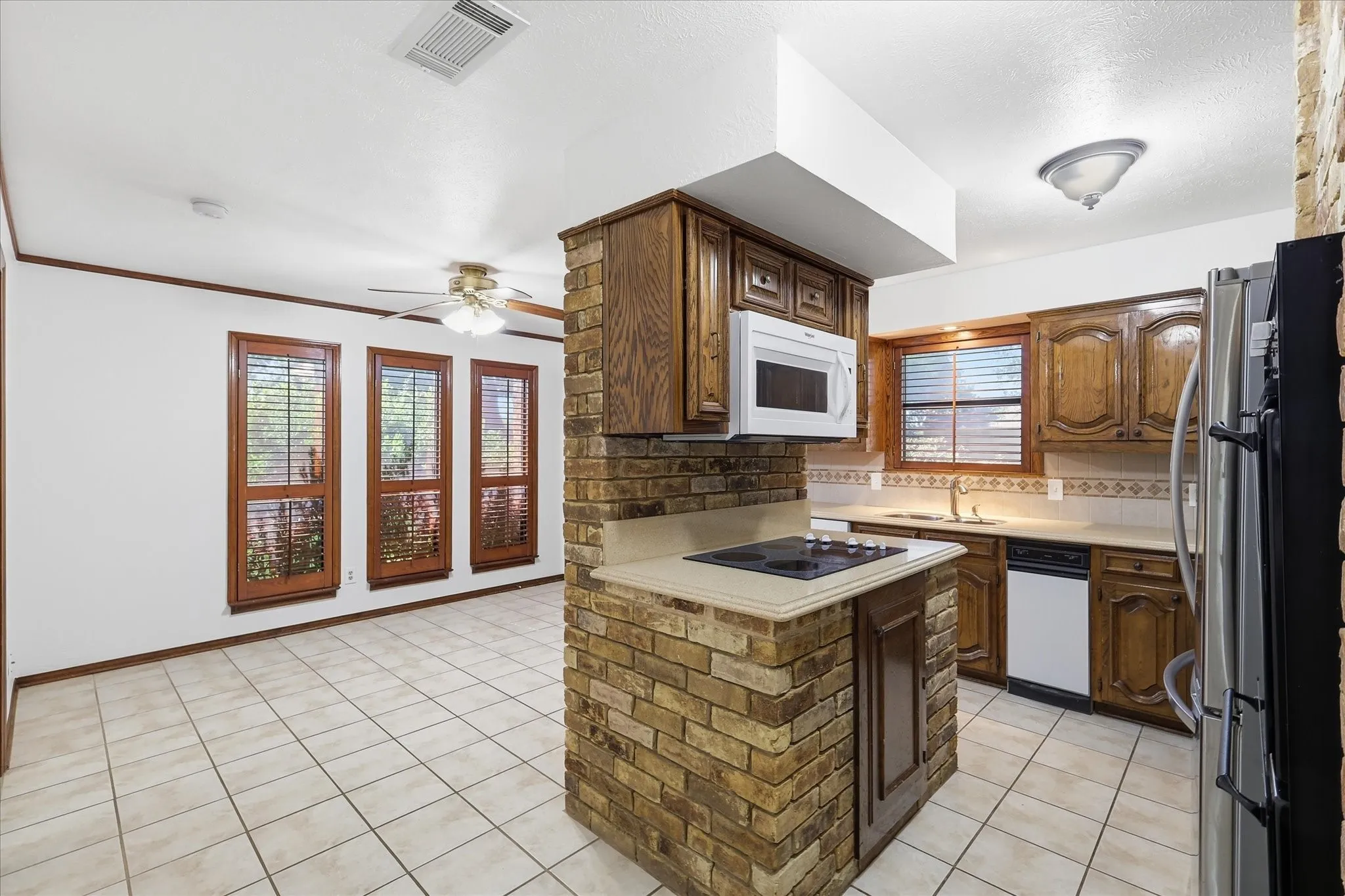 Spacious kitchen with breakfast area, ample counter and cabinet space, and a double oven. Fridge available for $25 per month.