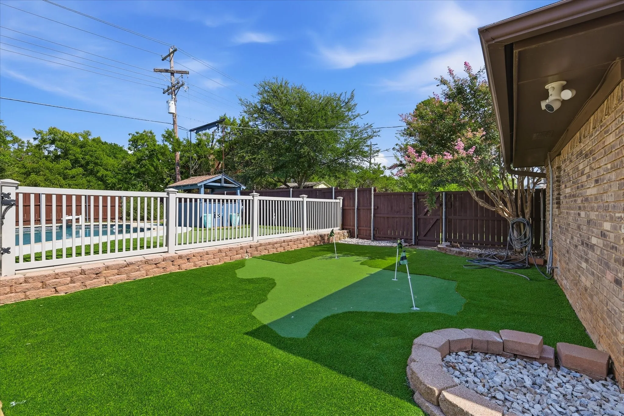 The custom 2-tiered putting green is perfect for hosting friends and family!