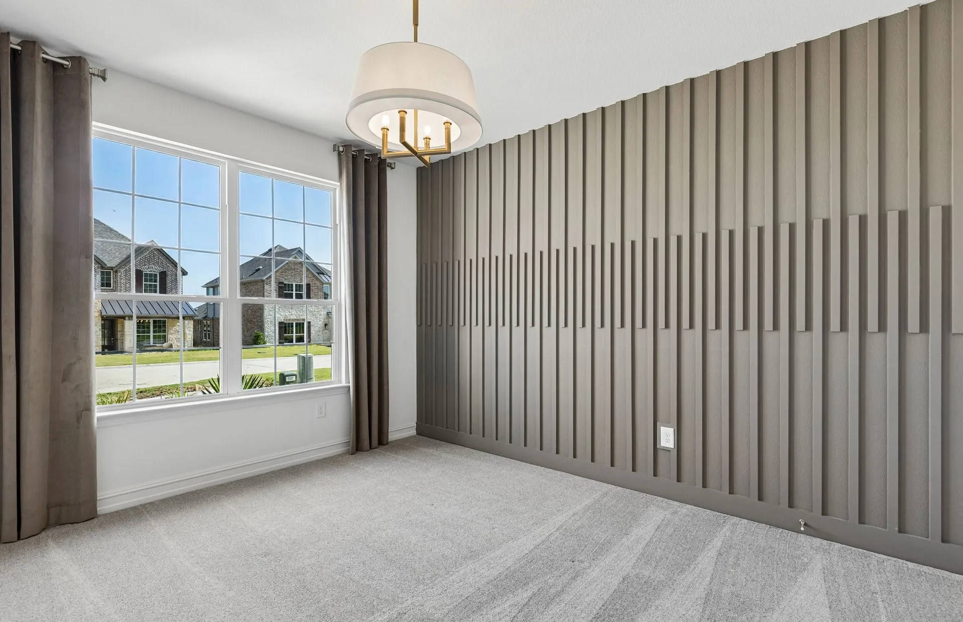 Secondary bedroom on first level with large window