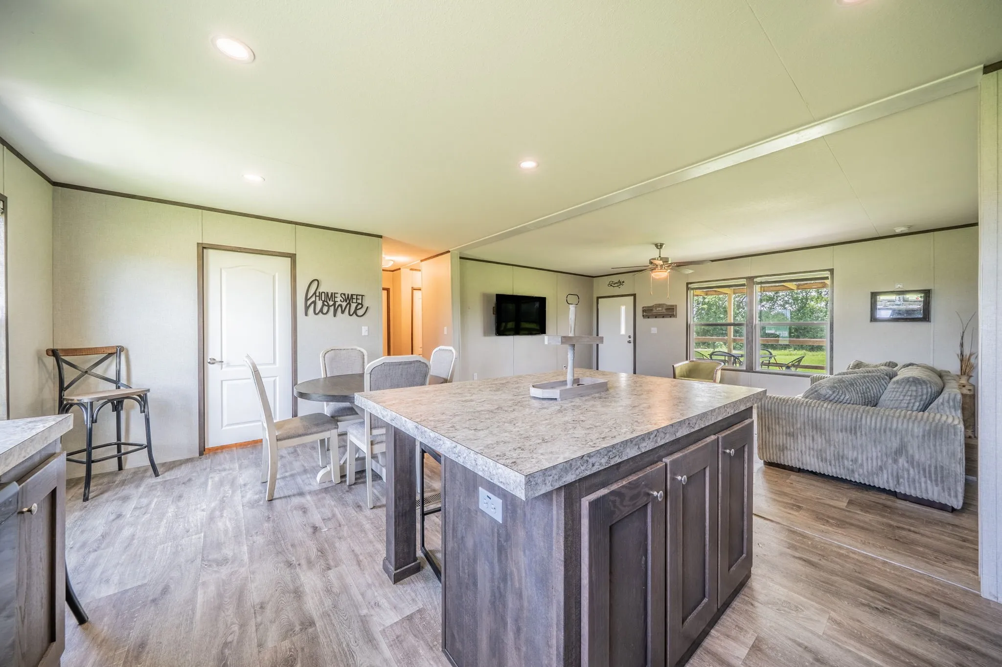Kitchen looking out to dining space and living area