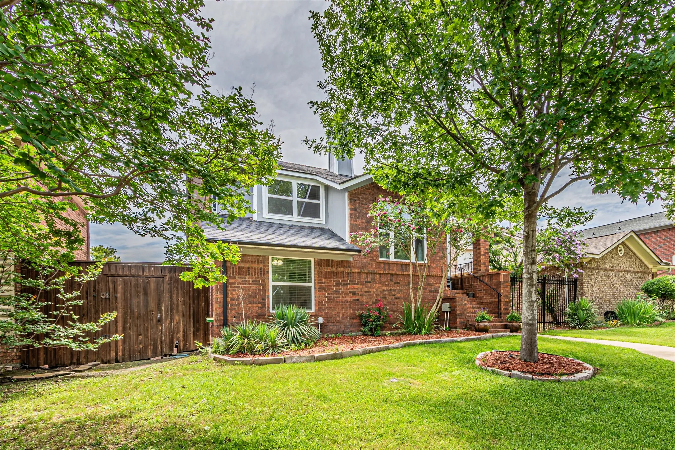 Brick exterior featuring a gabled roofline