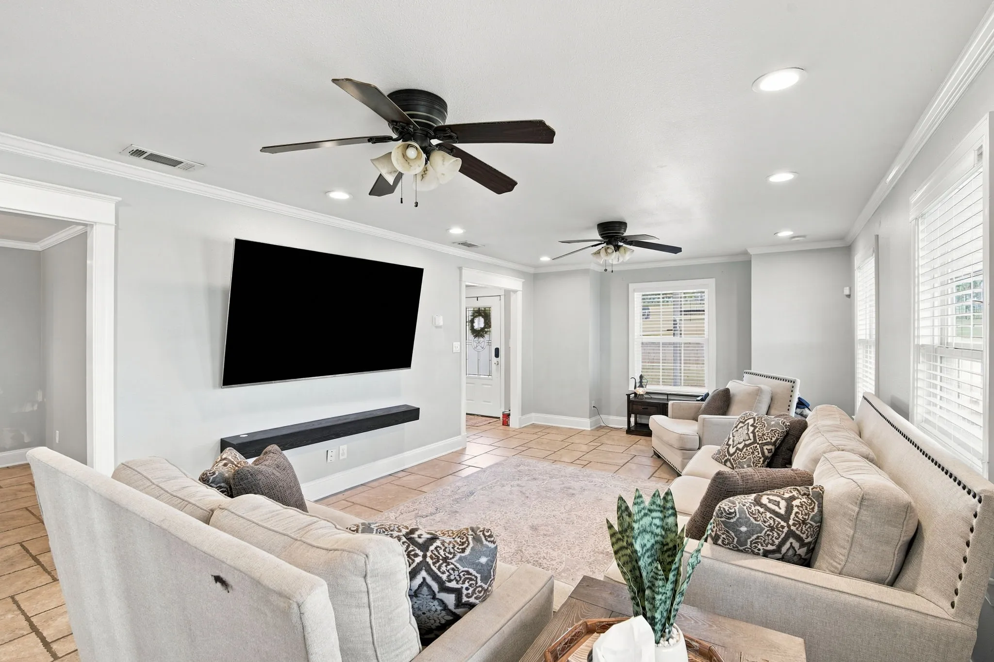 Living room with tons of windows and natural light.