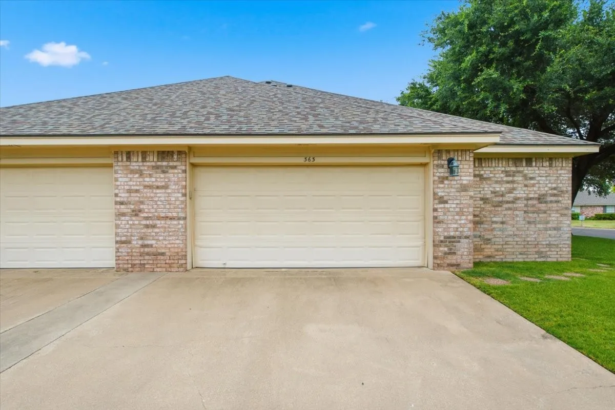 Brick exterior with garage door entry