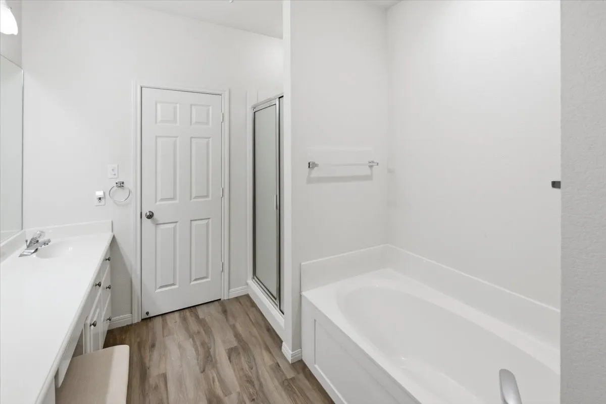 Bathroom featuring a white vanity with ample counter space