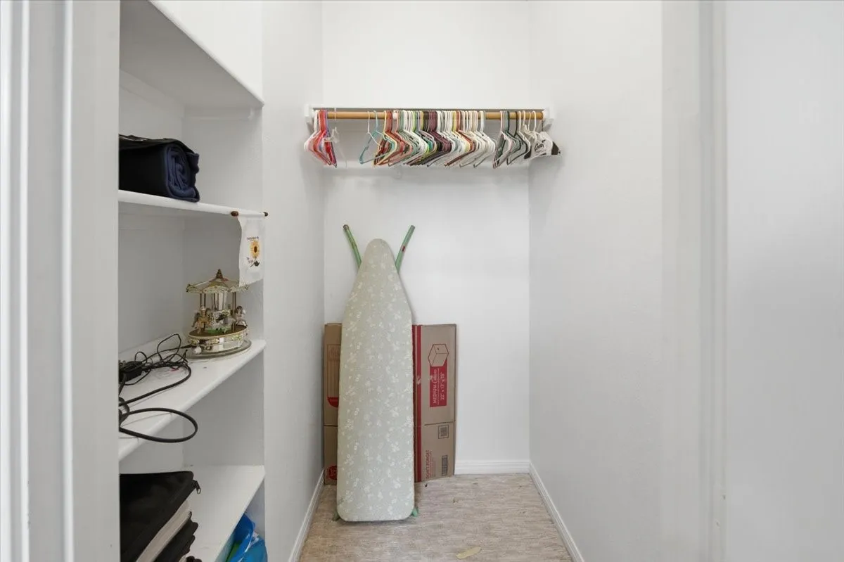 Walk-in closet in secondary bedroom