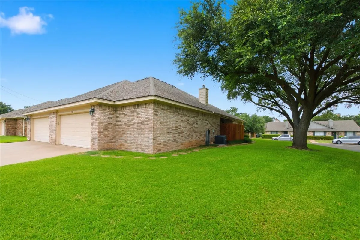 Back view of home and garage entrance