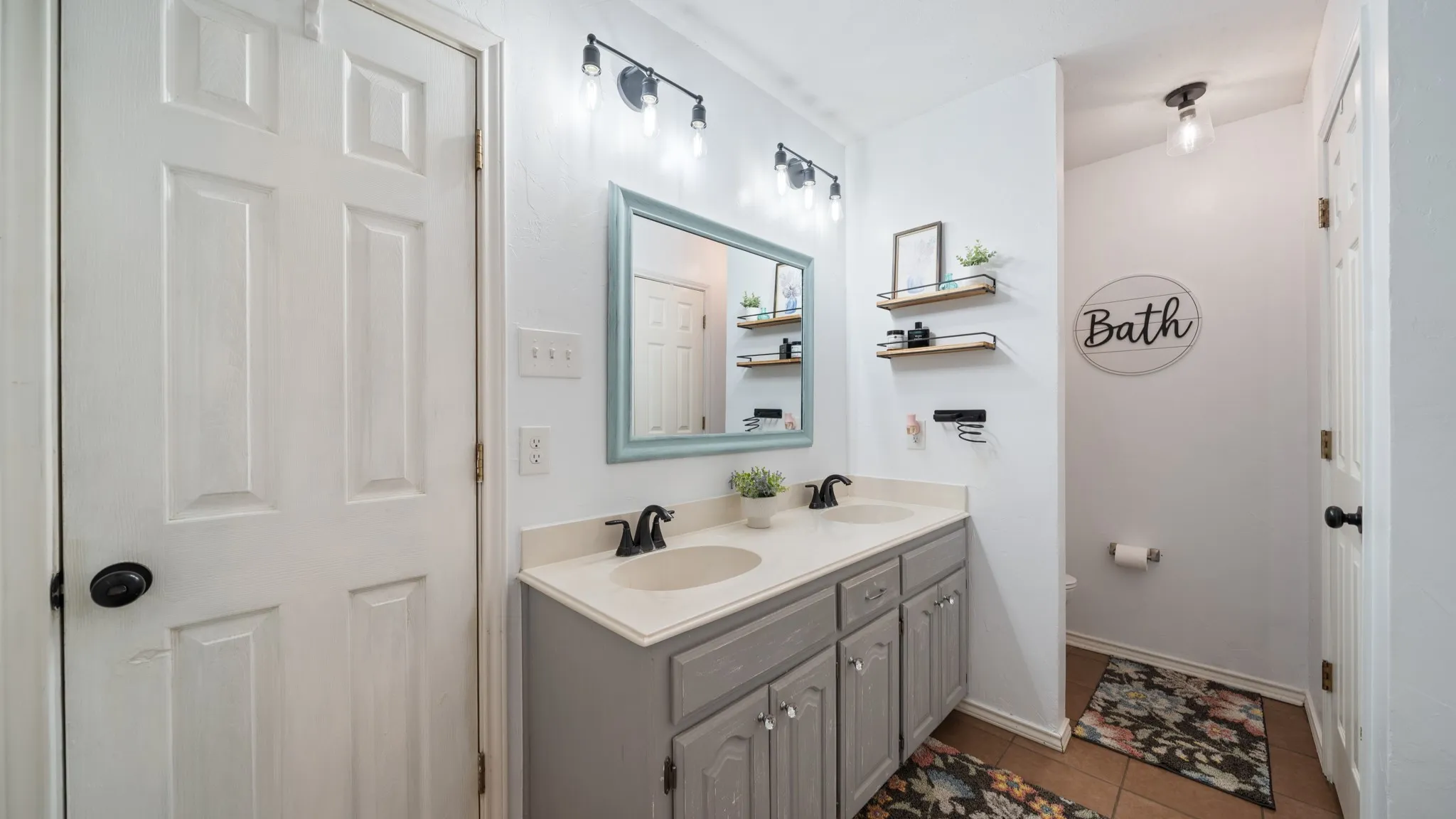 Primary Bathroom featuring double sinks