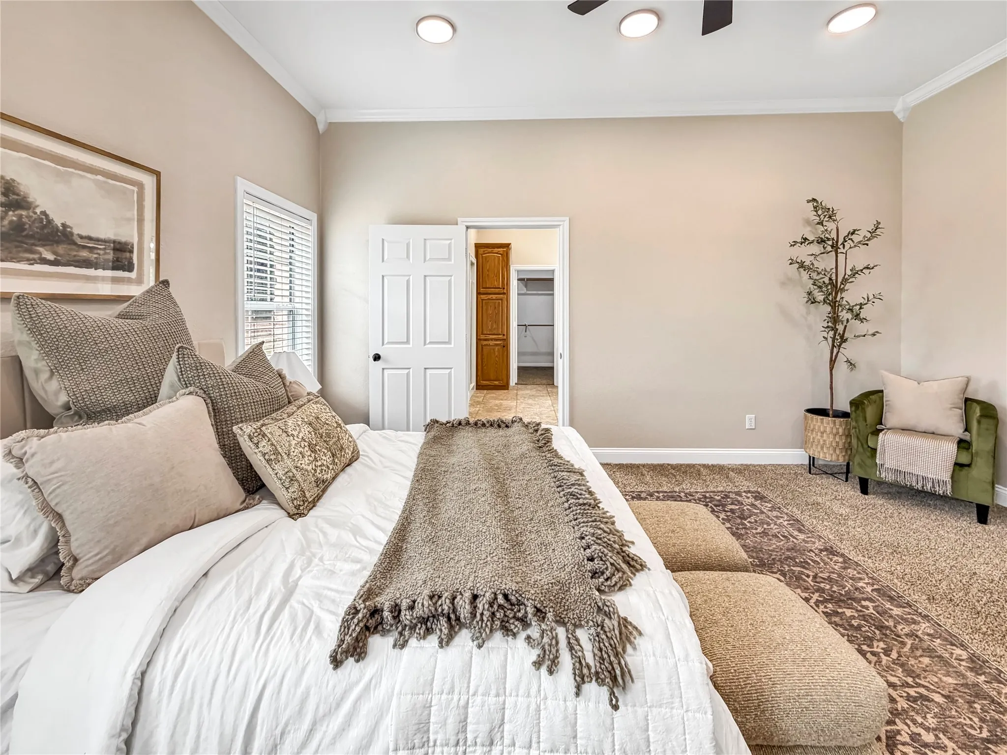 Carpeted room featuring crown molding and recessed lighting