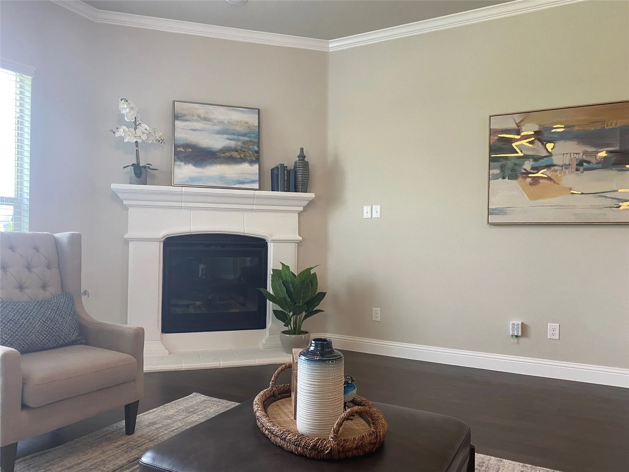 Living room with hardwood / wood-style flooring, ornamental molding, and plenty of natural light