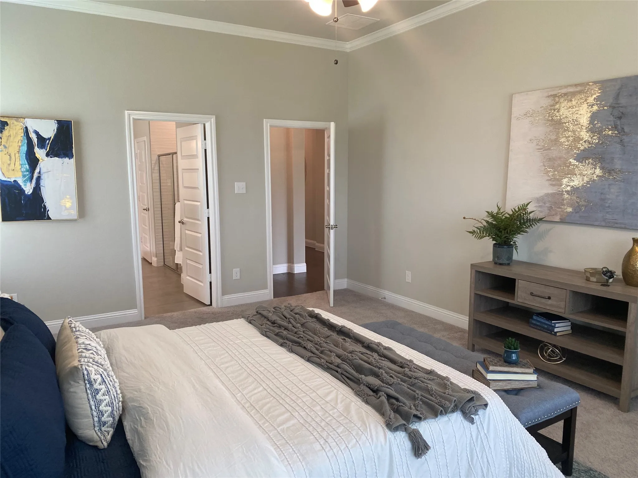 Bedroom with carpet flooring and ornamental molding