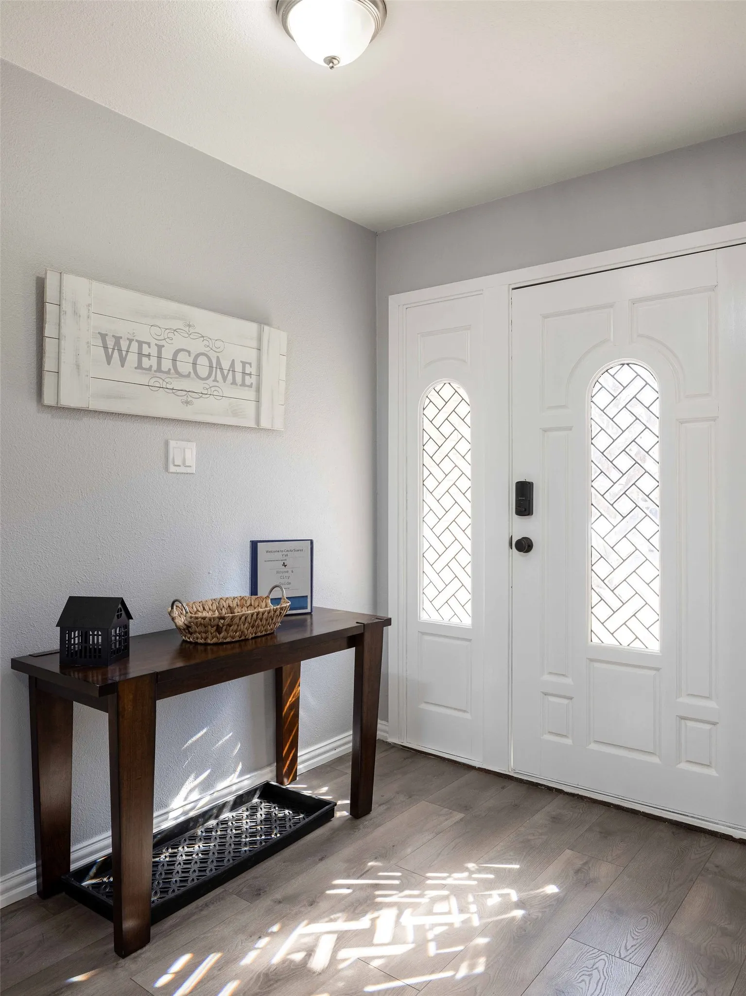 Foyer entrance with wood finished floors