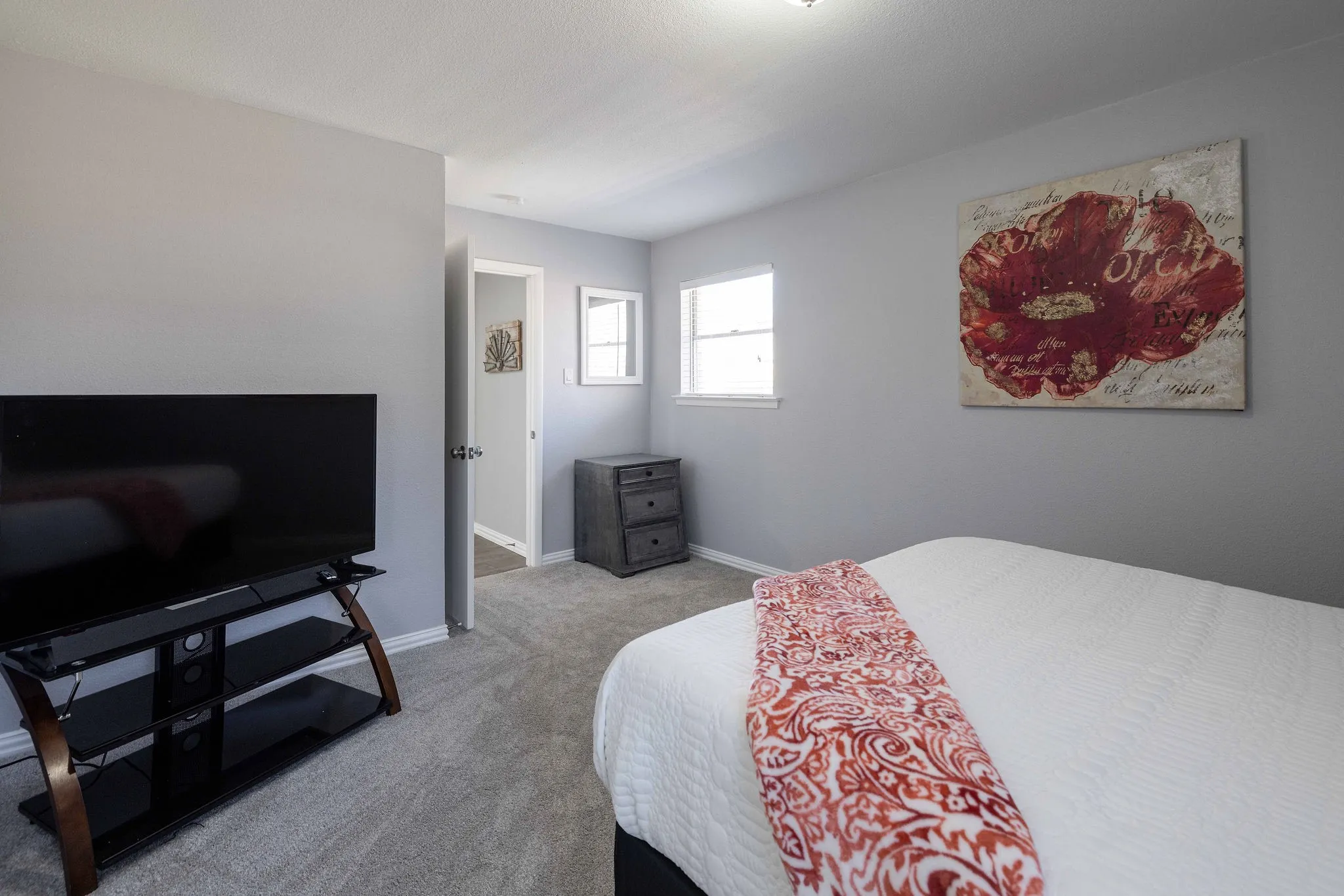 Bedroom with carpet and baseboards