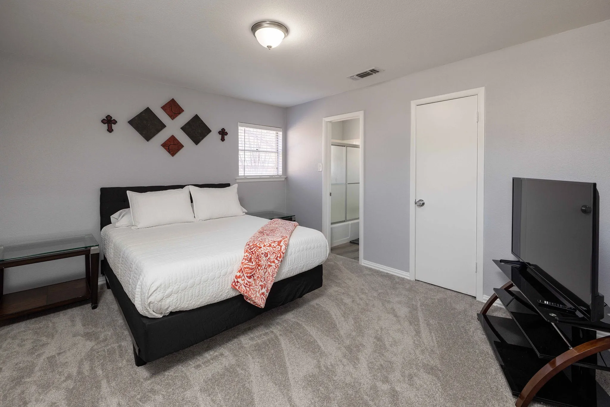 Bedroom with carpet flooring and baseboards