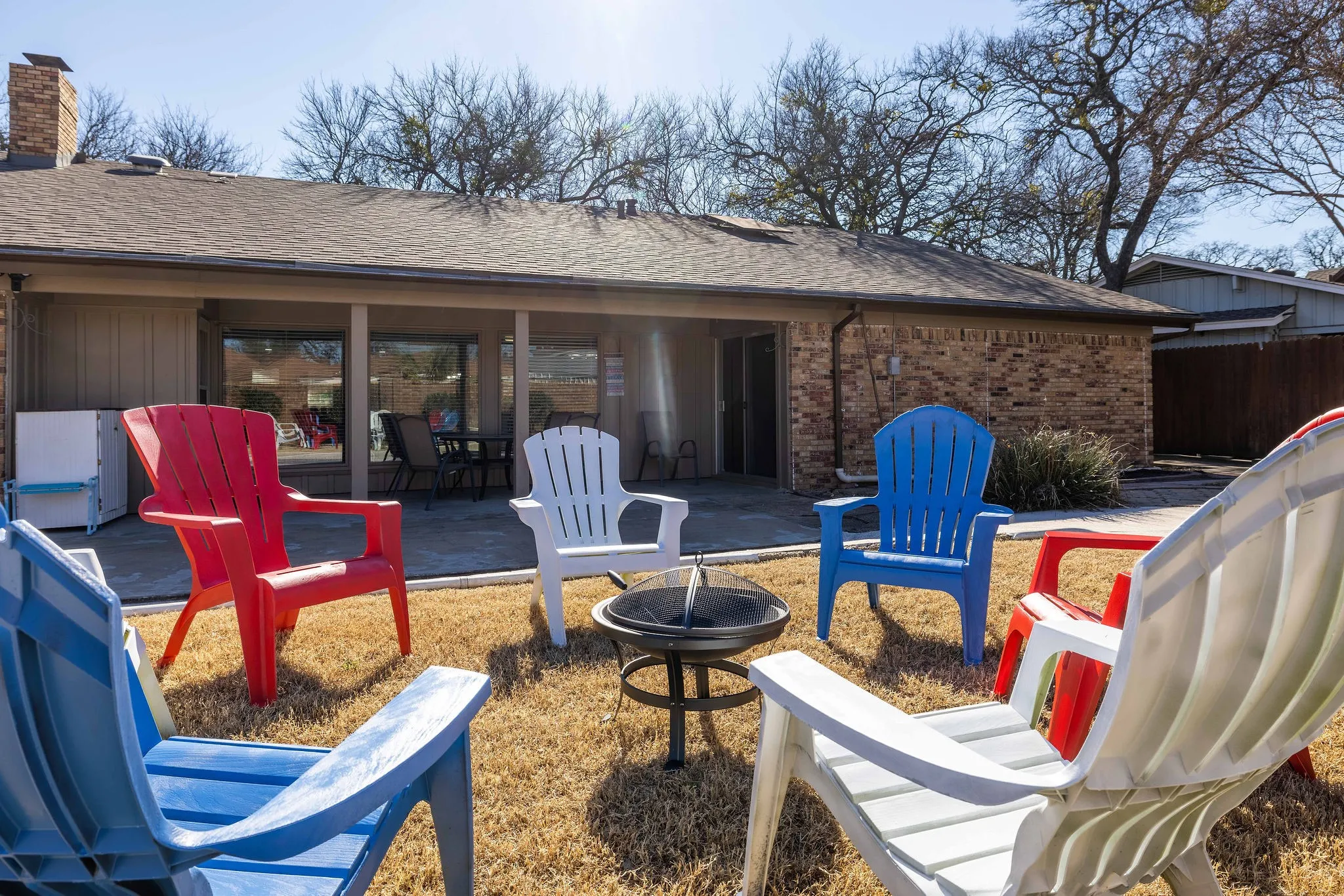 View of patio with an outdoor fire pit