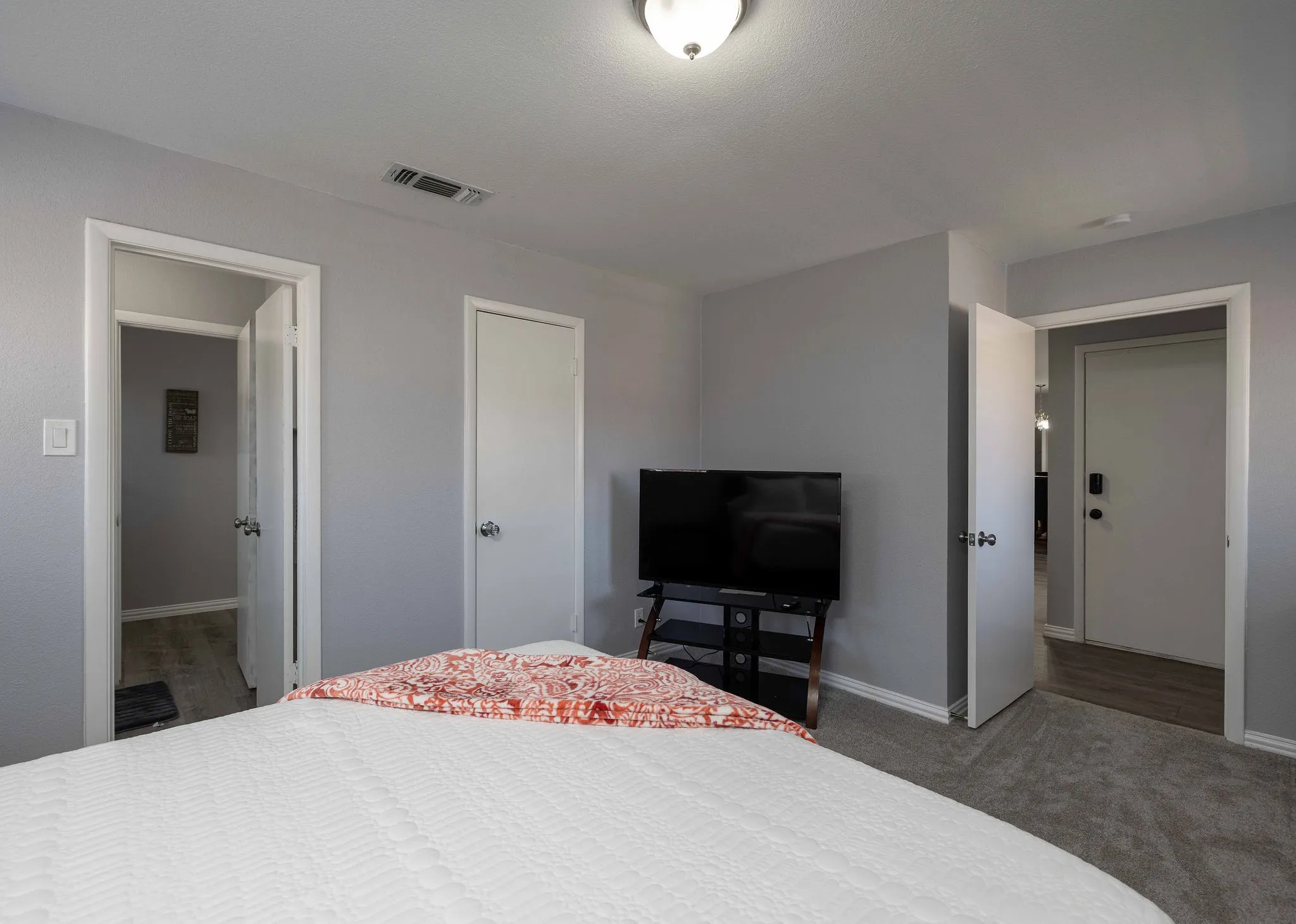 Bedroom with baseboards and carpet