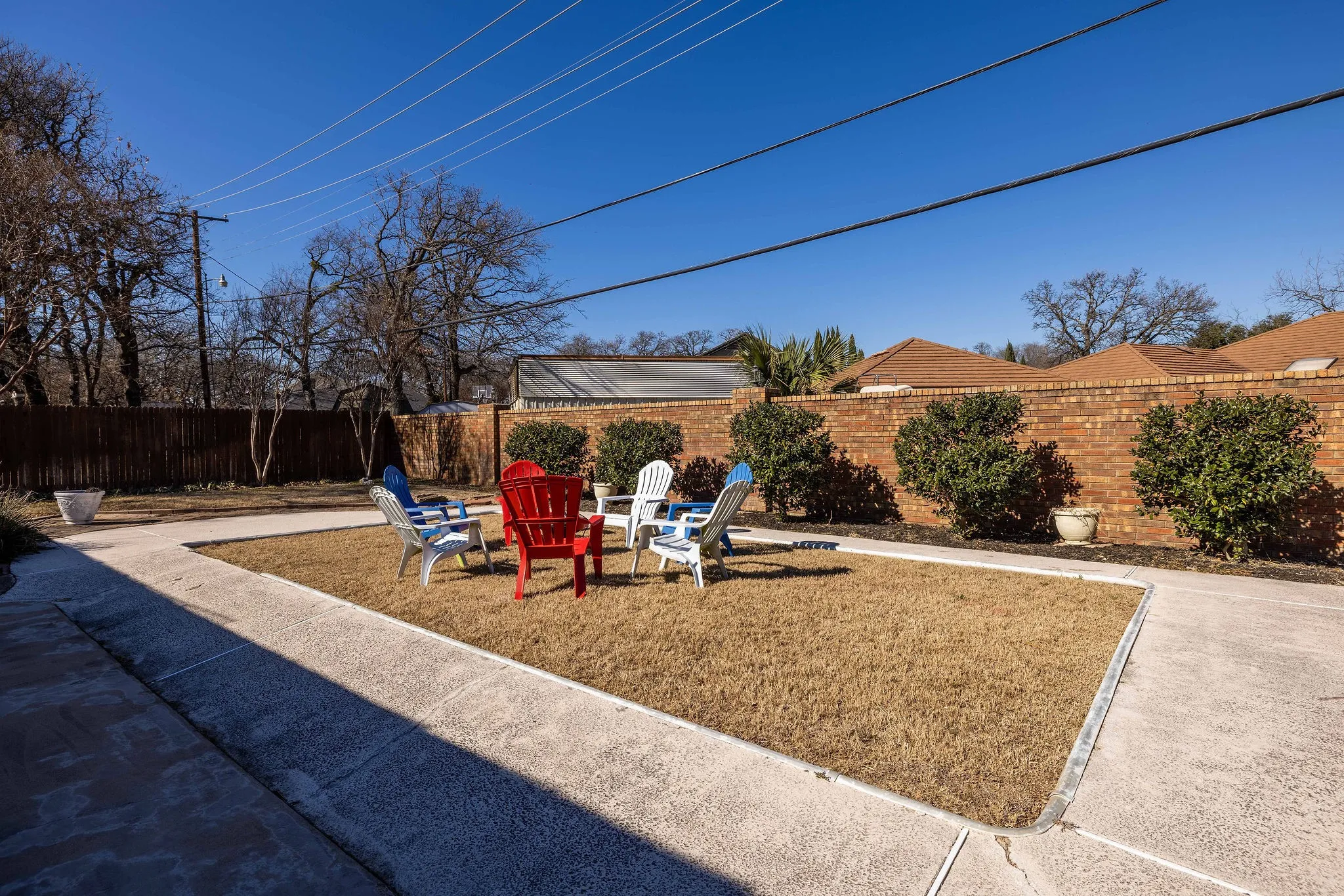 Fenced backyard with a patio