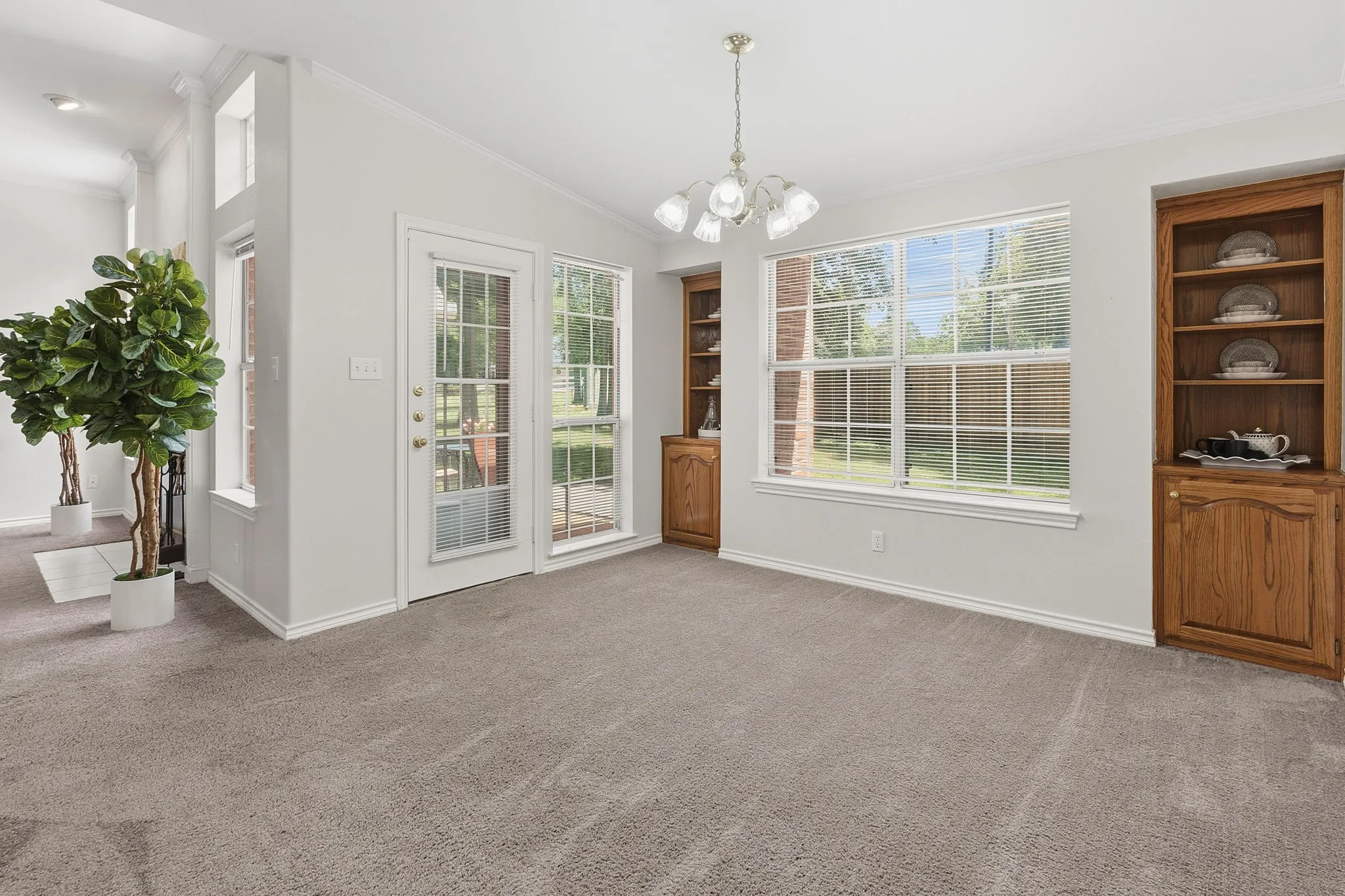 The dining room includes beautiful built-ins and could also function as a second living area, den, game room, craft room, or home office.