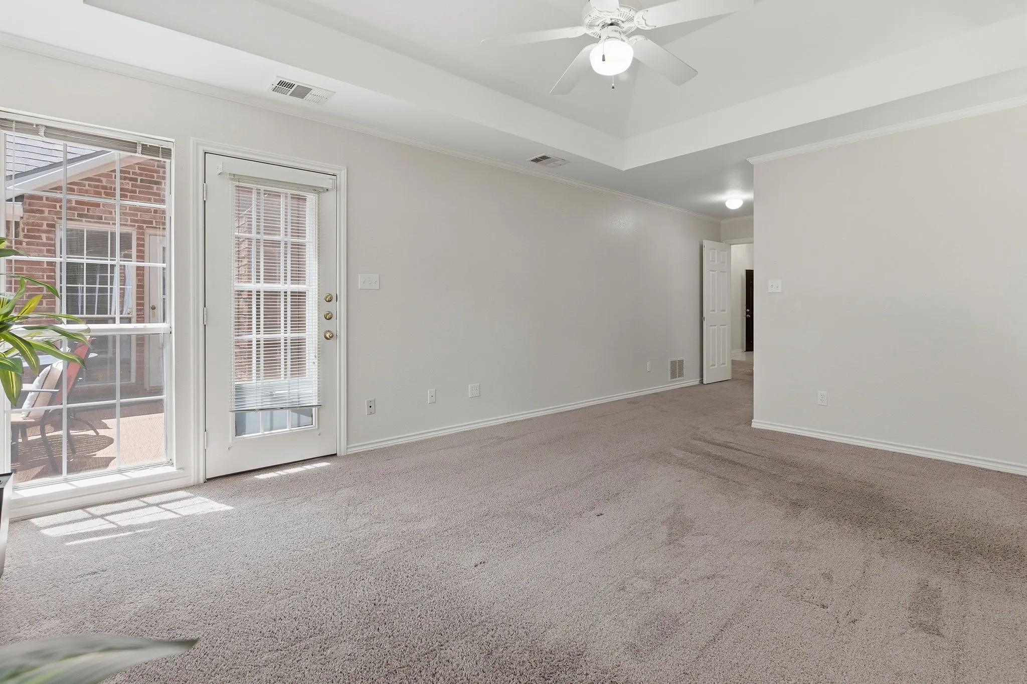 The primary suite features a door to pation and ensuite bath with oversized garden tub, walk-in shower, dual sinks, and a large walk-in closet.