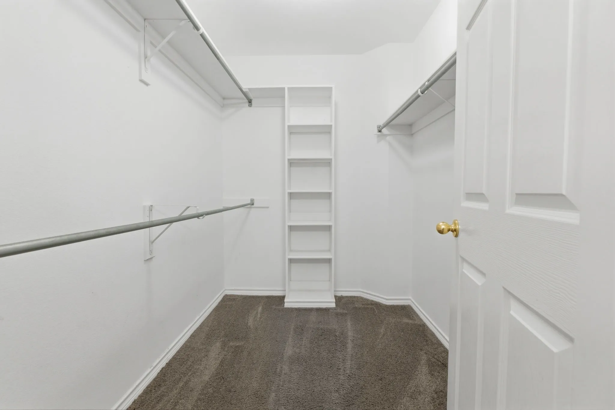 The primary suite features a door to pation and ensuite bath with oversized garden tub, walk-in shower, dual sinks, and a large walk-in closet.