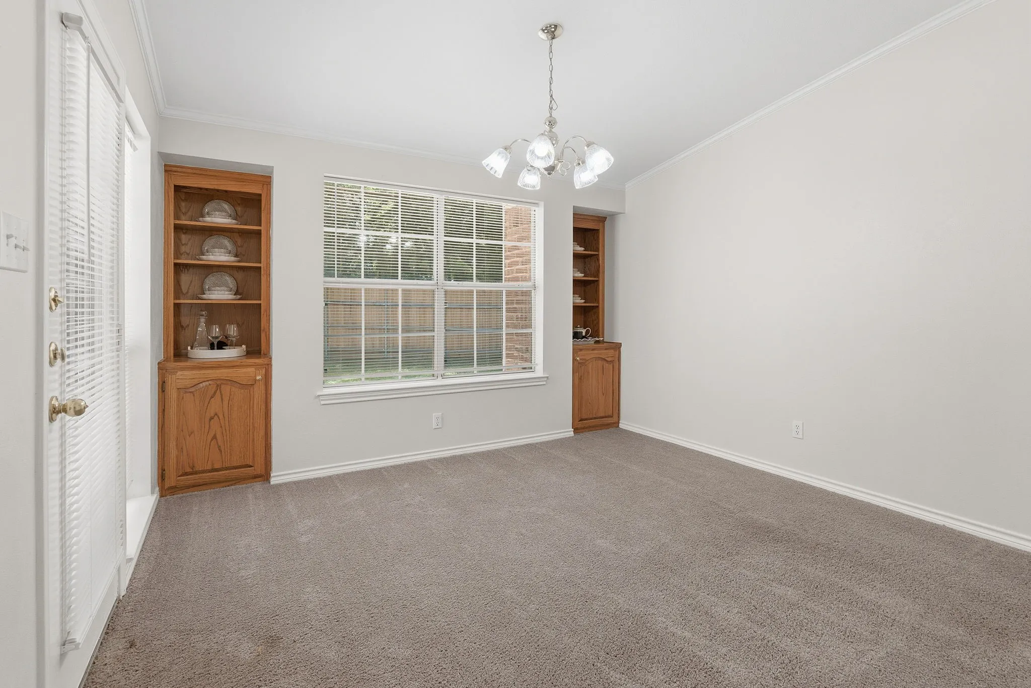 The dining room includes beautiful built-ins and could also function as a second living area, den, game room, craft room, or home office.