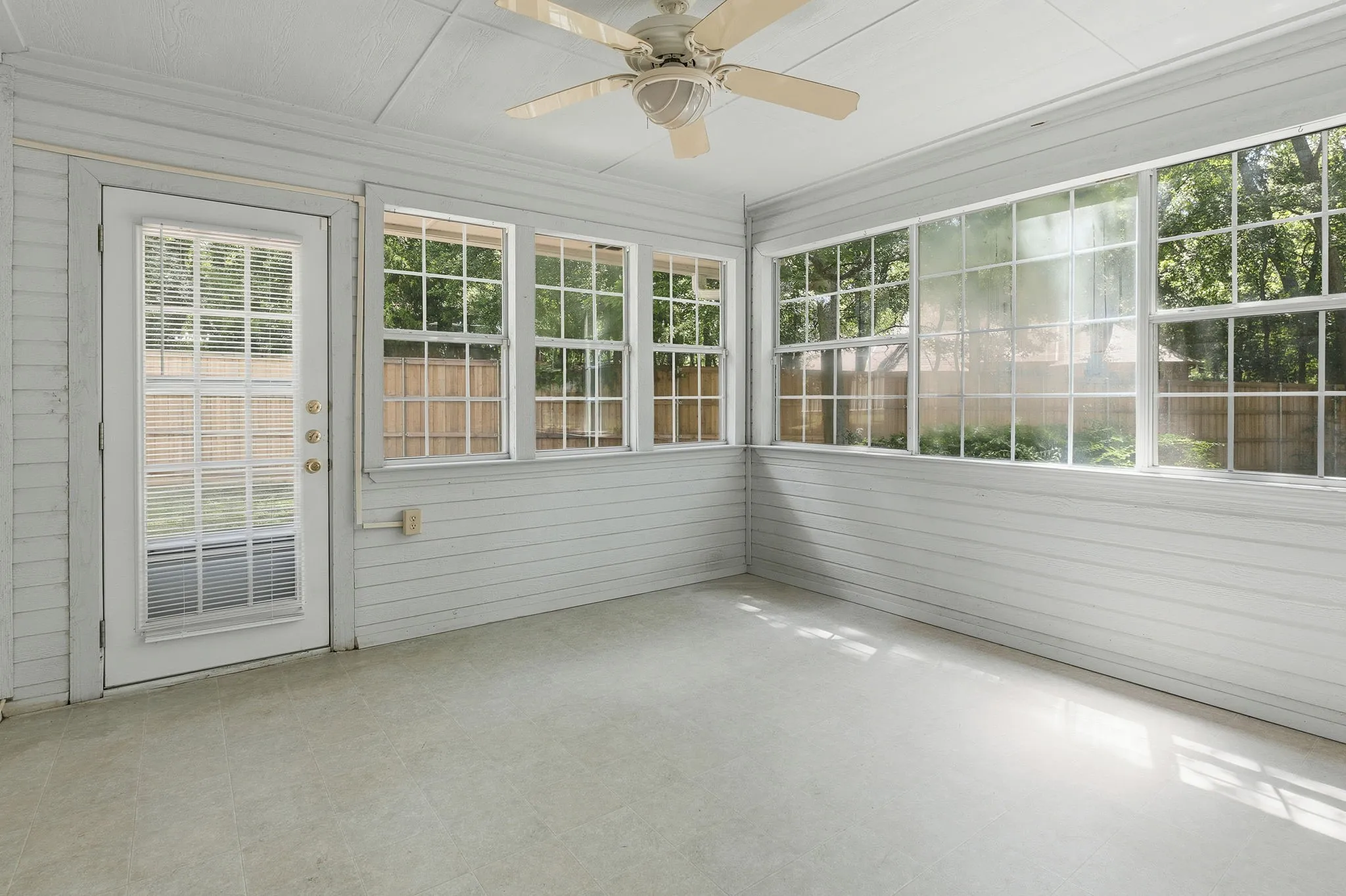 A light-filled sunroom offers even more space for hobbies, workouts, plants, or quiet relaxation.
