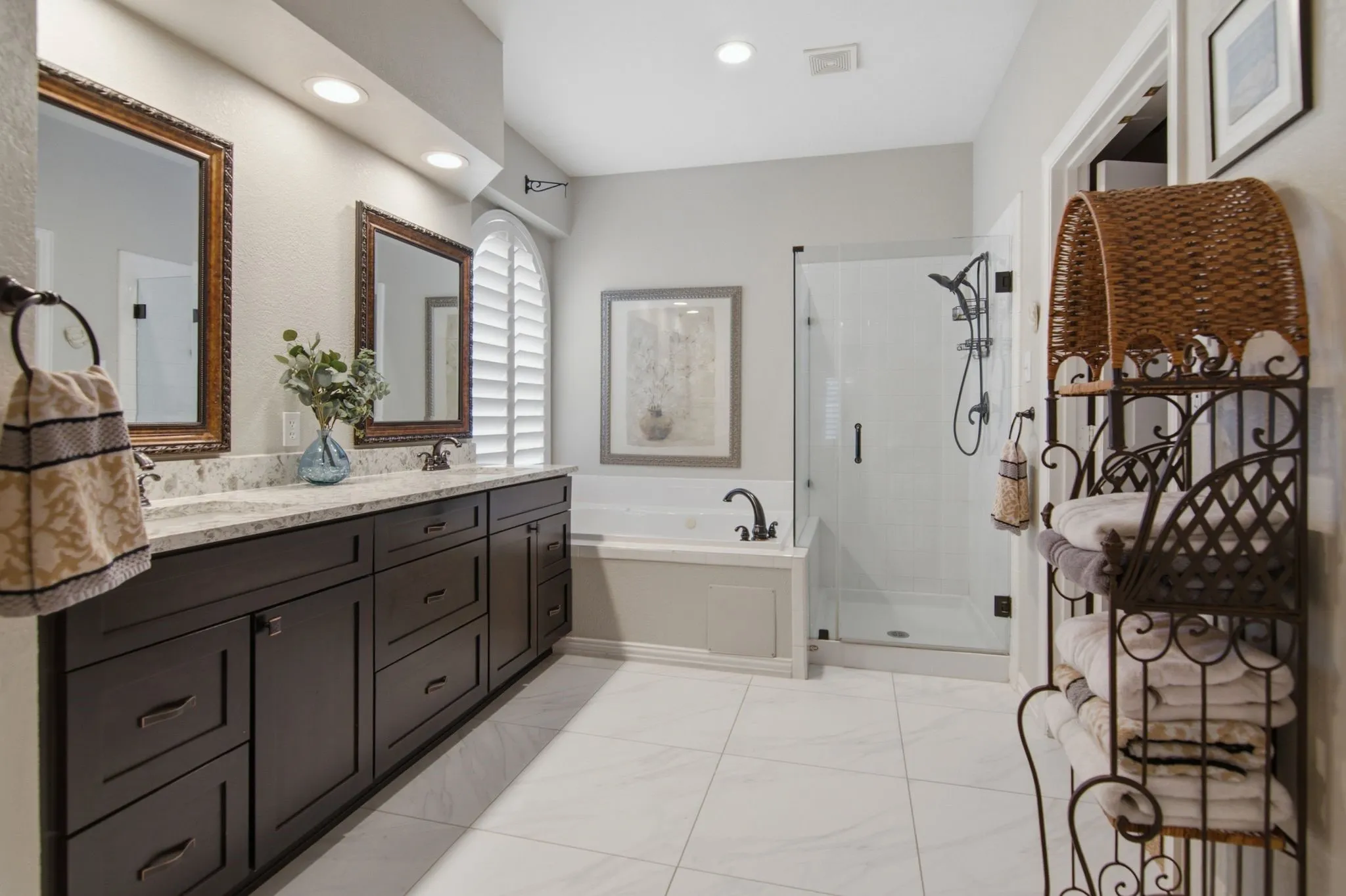 Spa inspired primary bath with jetted tub, linen closet,separate shower and walk-in closet.