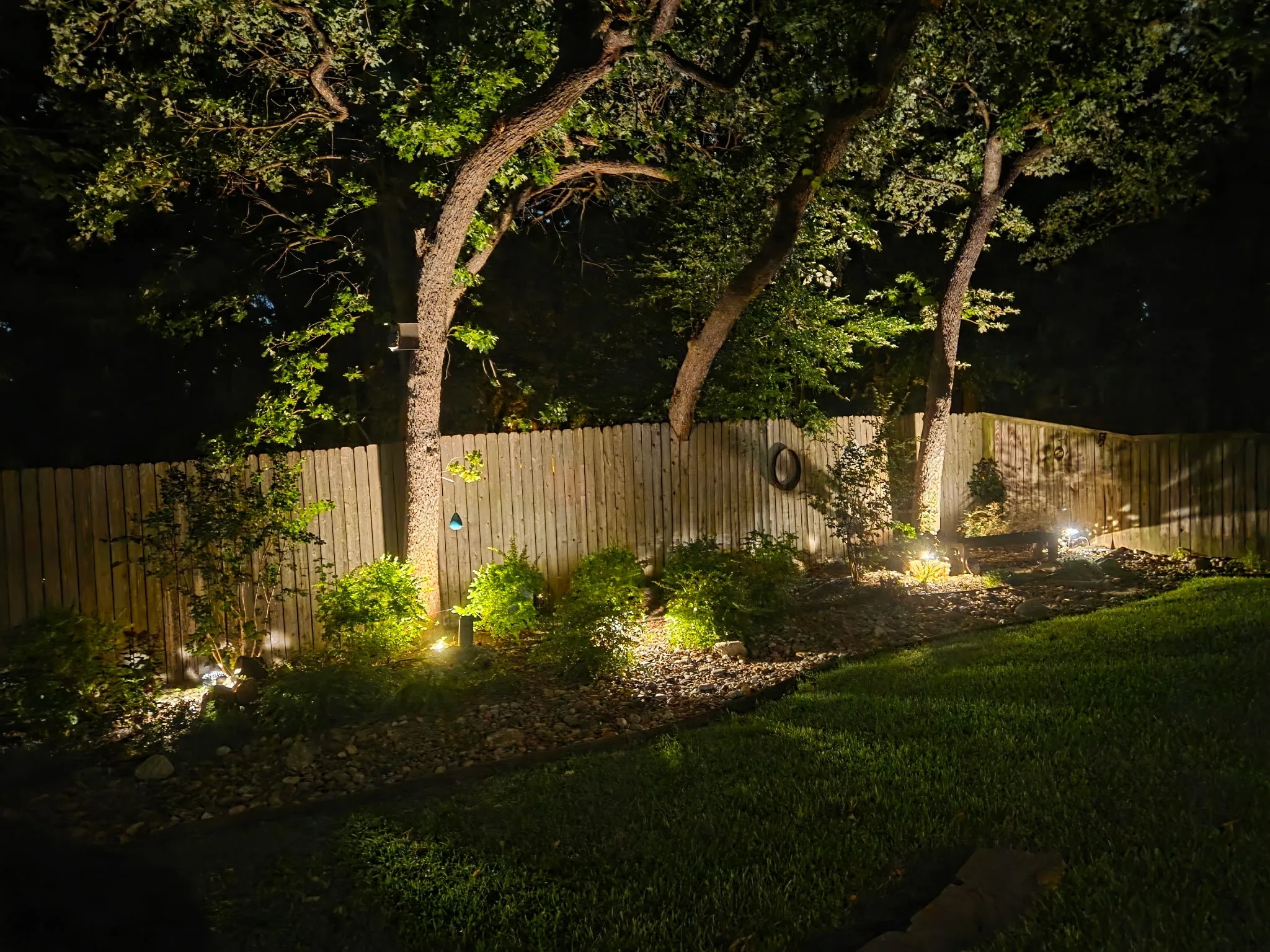 Beautiful landscaping with outdoor yard lights.