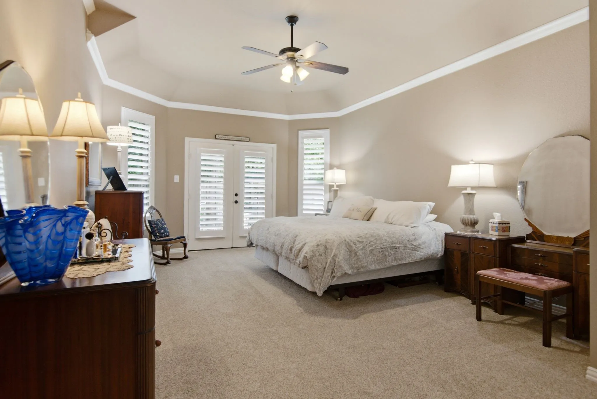 Private Owner's Suite wih crown molding and double doors to a second patio.