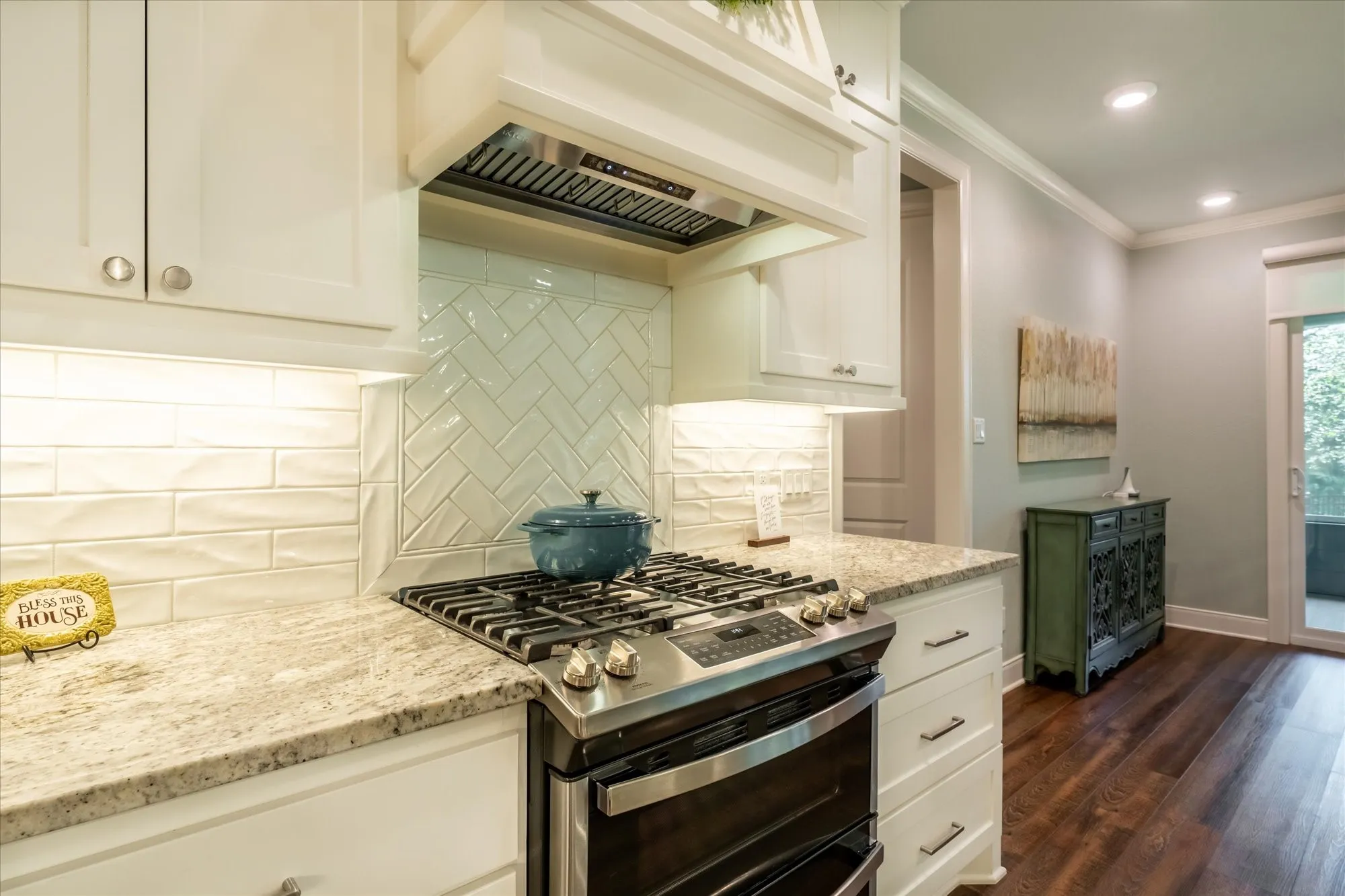 Propane gas range cooktop with convection and air frying range stove.  Beautiful subway tile and upgraded vent-a-hood for the chef in all of us.