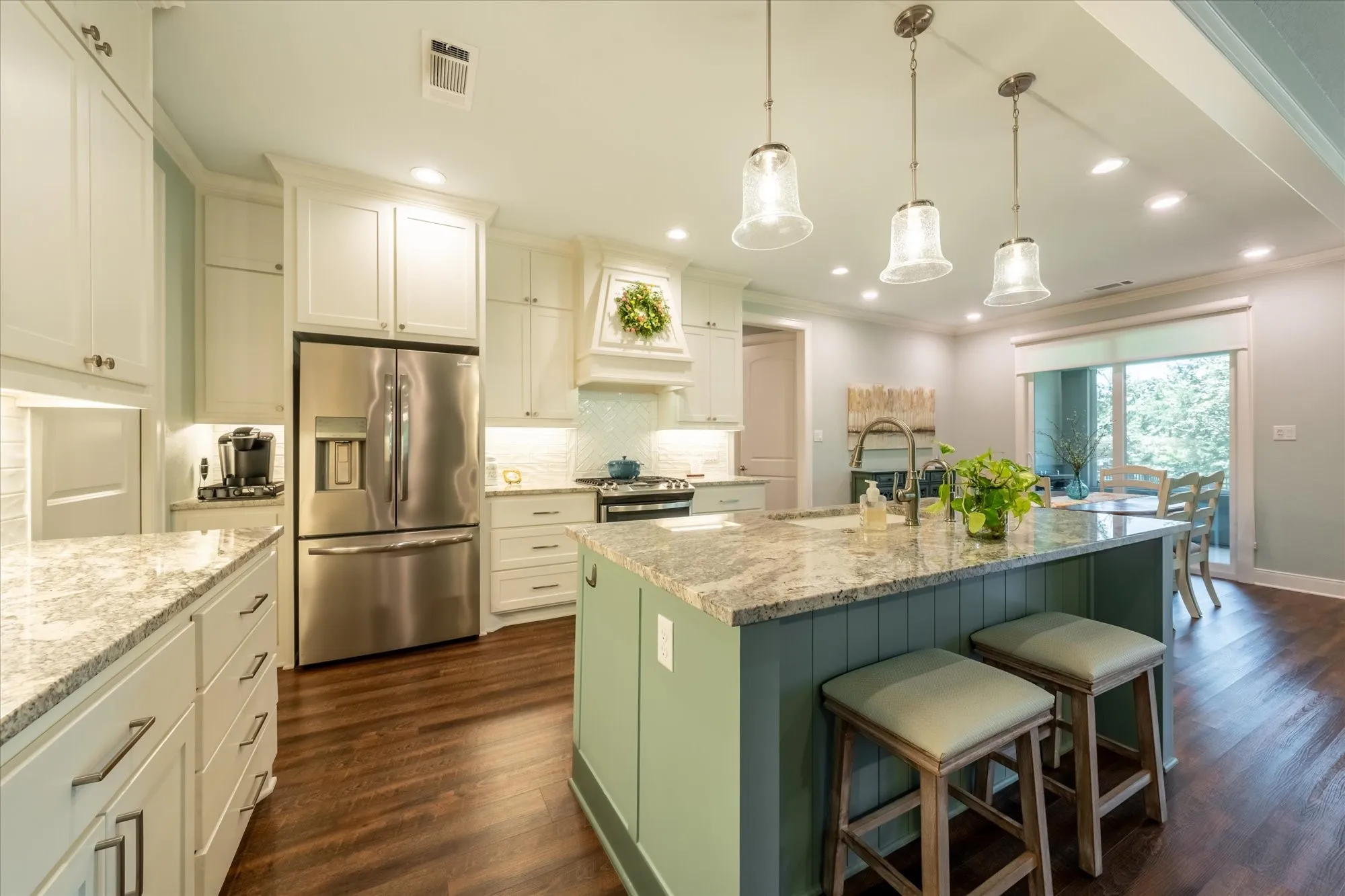 Large kitchen island with quartz countertops and all the bells and whistles.
