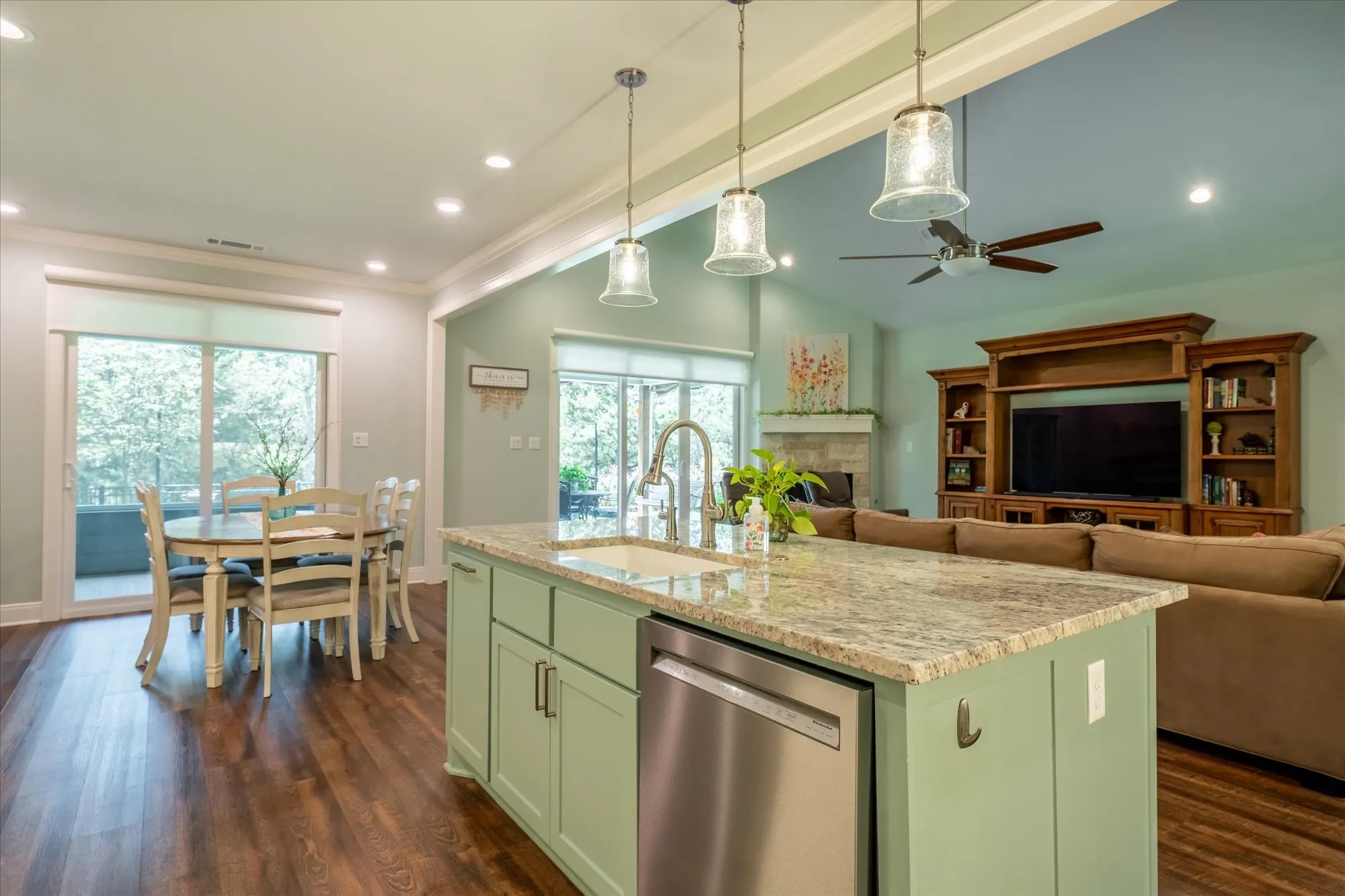 The left sliding doors go out to a beautiful screened in porch for summer nights. And the right doors go out to spacious covered patio.