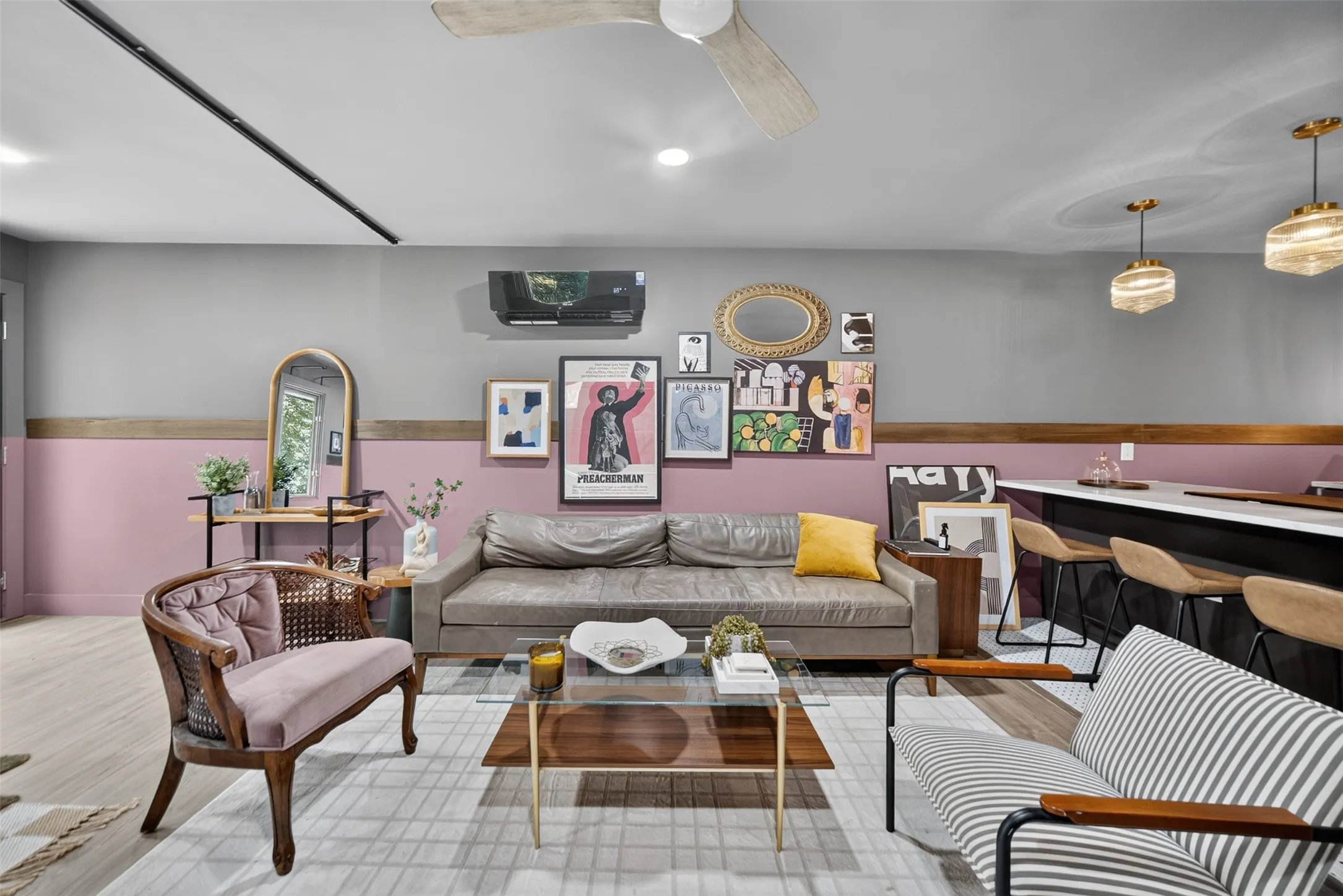 Open-concept living space featuring wood-finish flooring, a contemporary ceiling fan, and recessed lighting