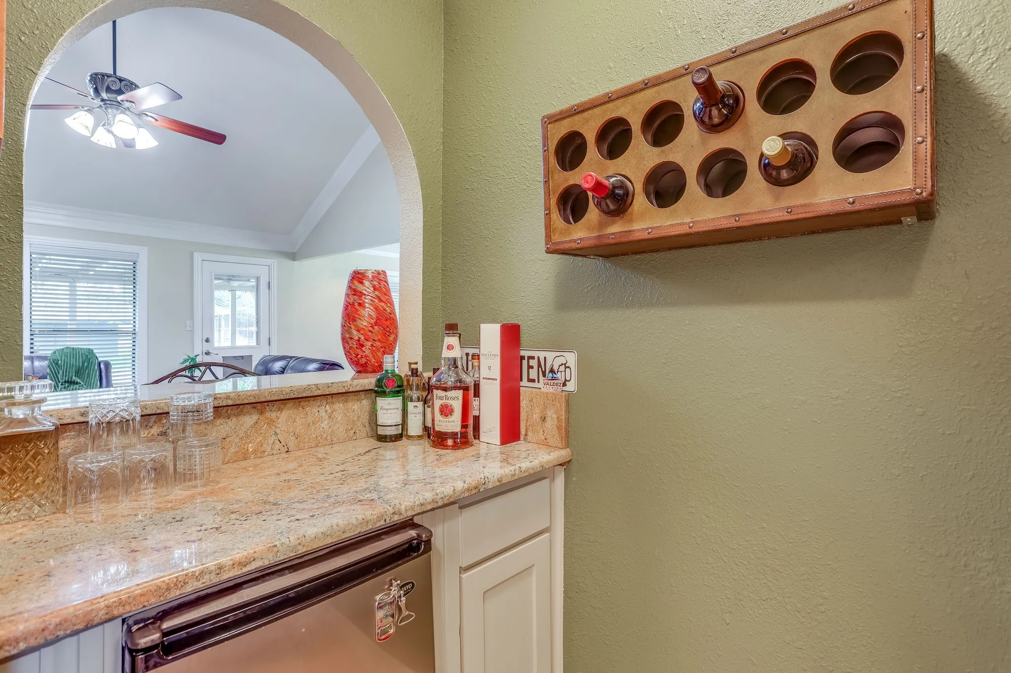 Updated bar area with new granite counter top, cabinets and mini fridge