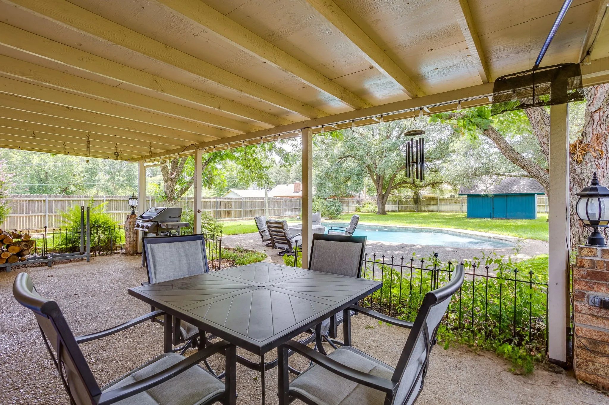 Covered patio overlooking the pool.