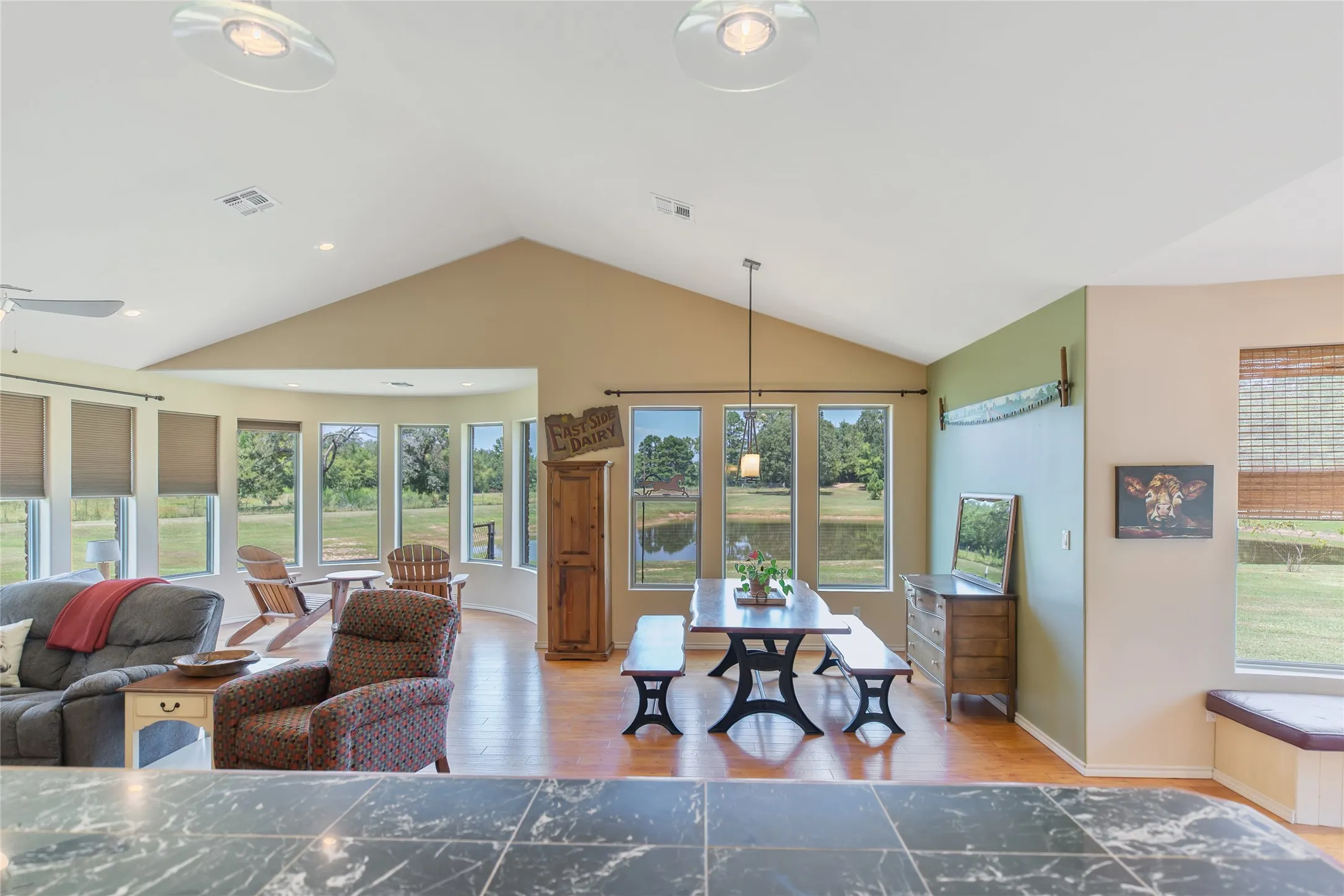 Open concept main living area with a view looking toward the kitchen and dining space.
