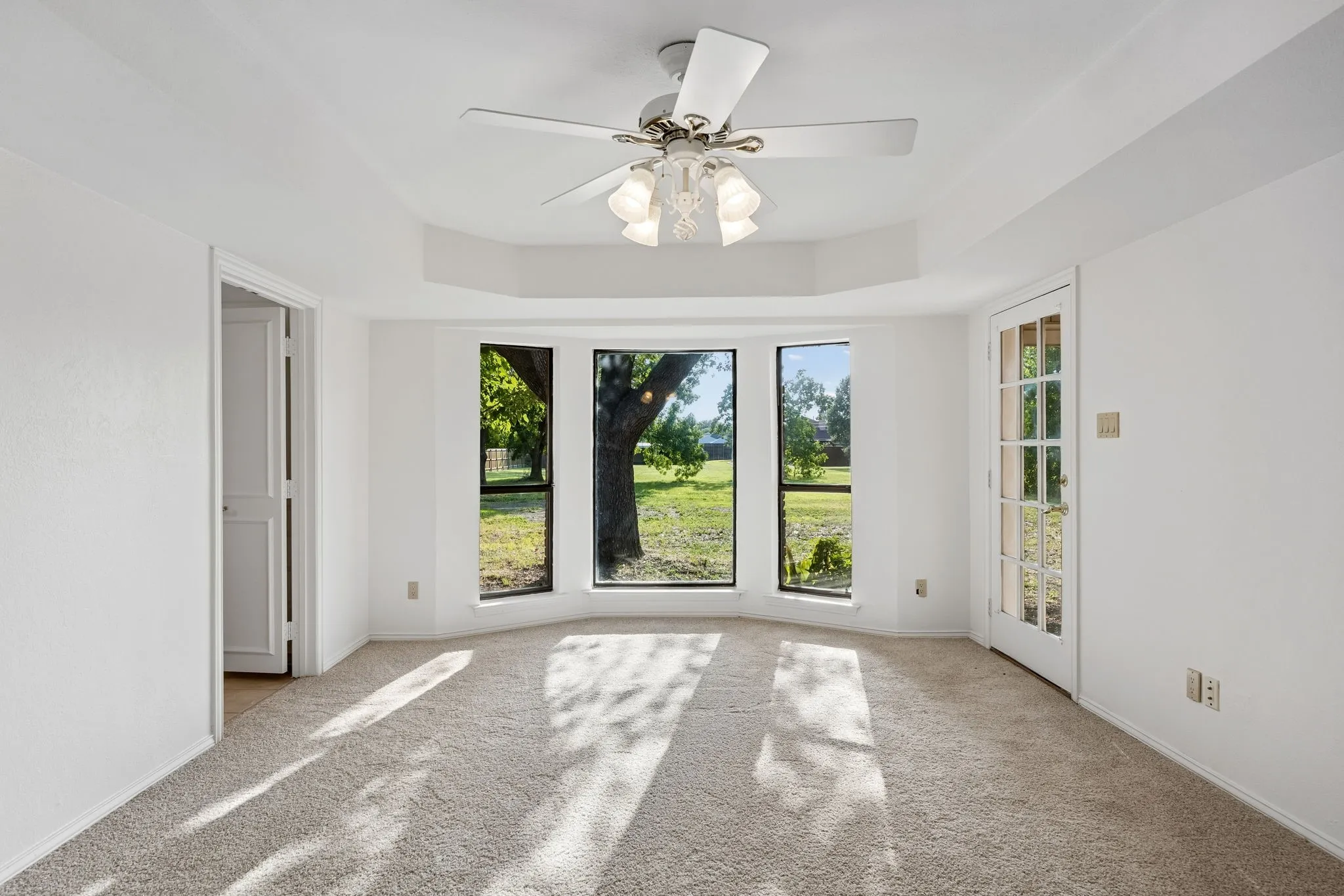 Spacious primary suite with patio access