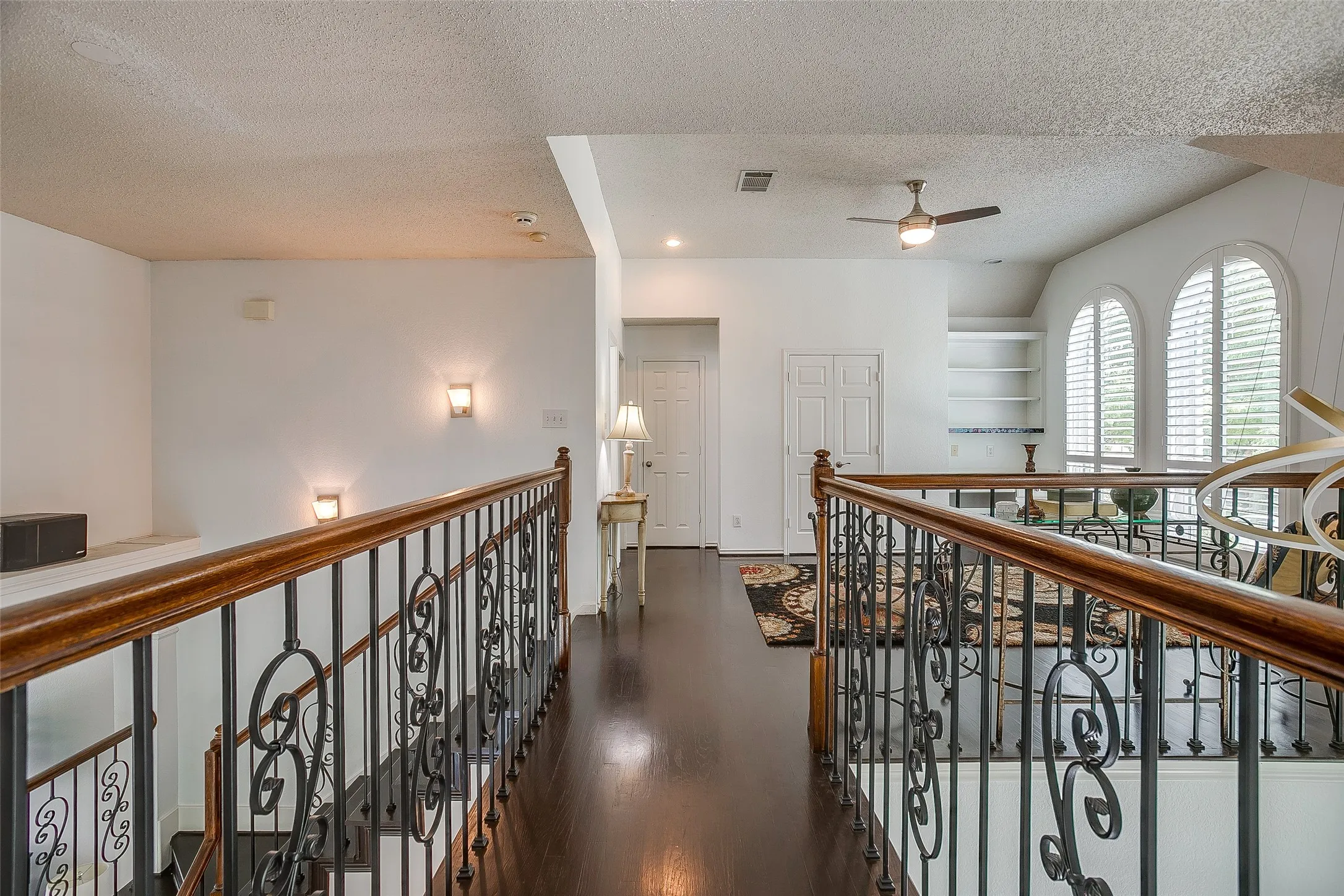 View from two secondary upstairs bedrooms to the third living room.