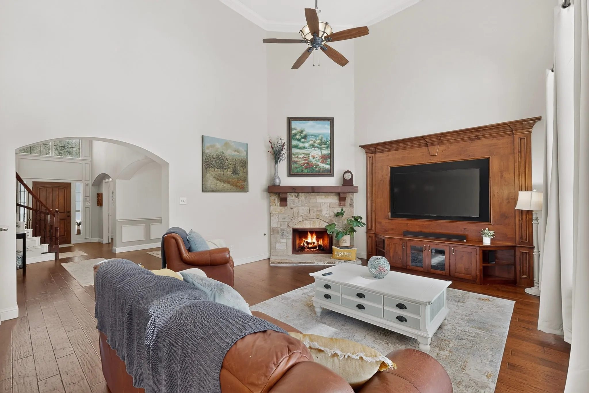 LIVING ROOM WITH CUSTOM BUILT IN ENTERTAINMENT CENTER